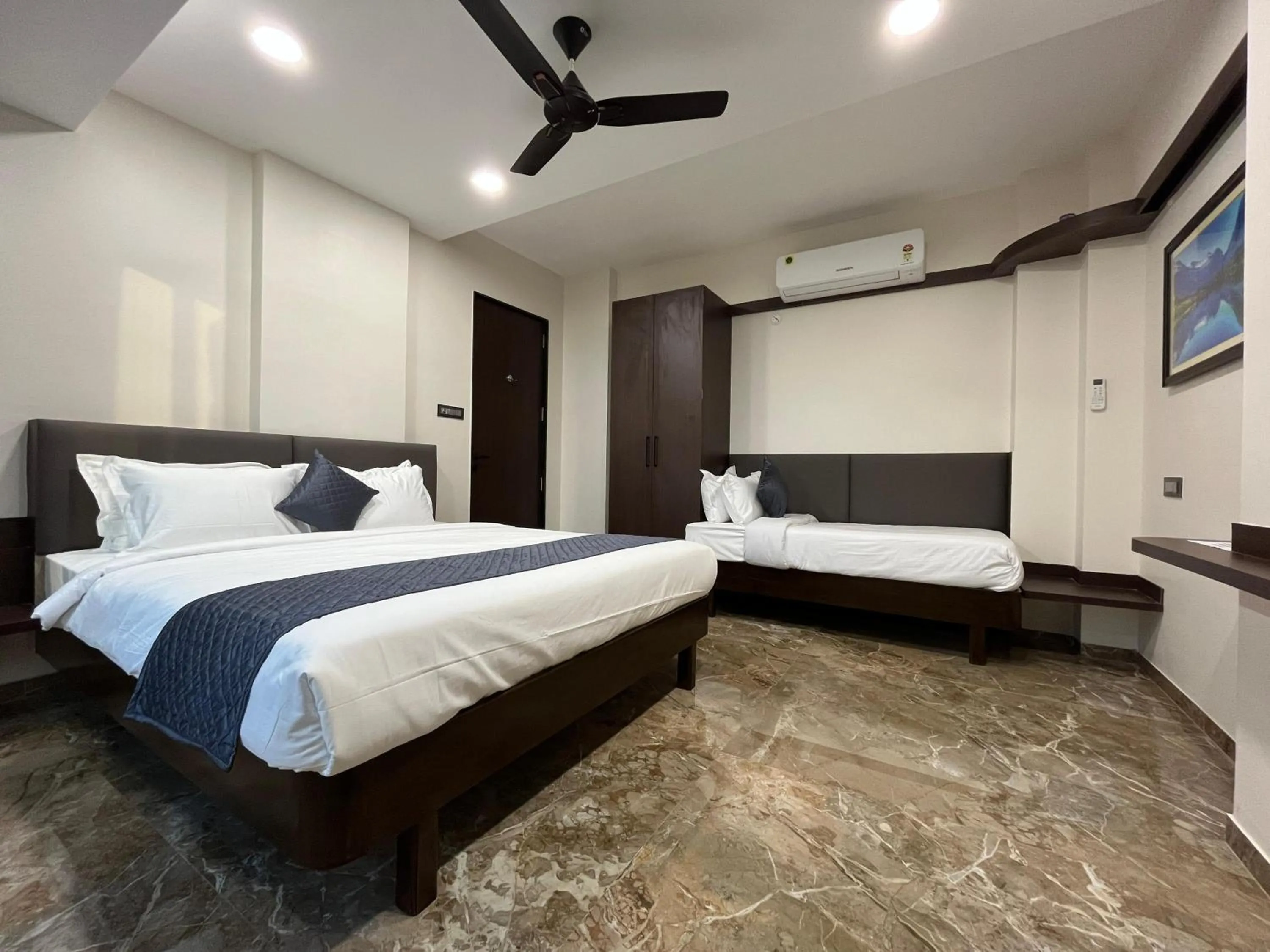 Bed in Kuber Suites