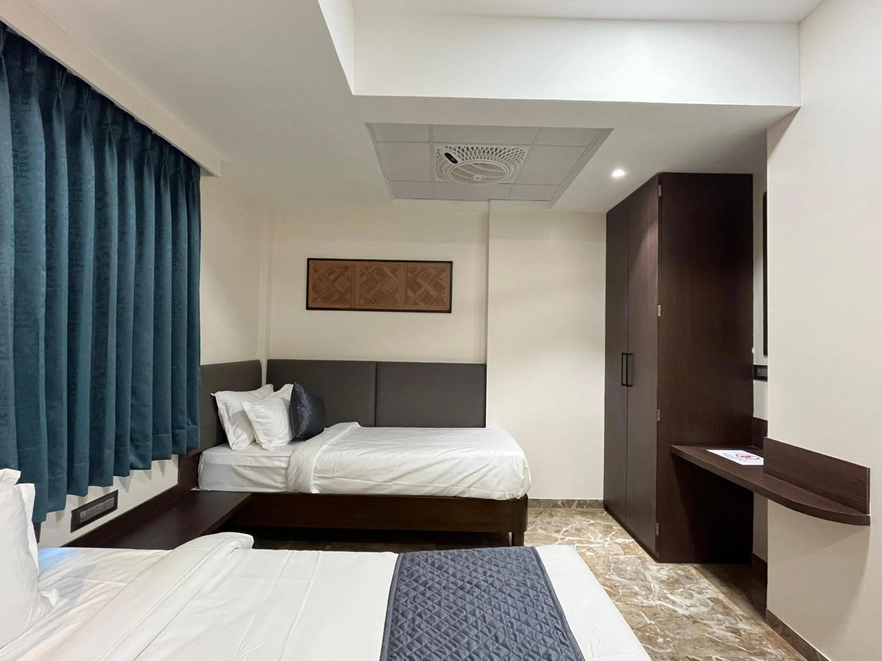 Bed in Kuber Suites