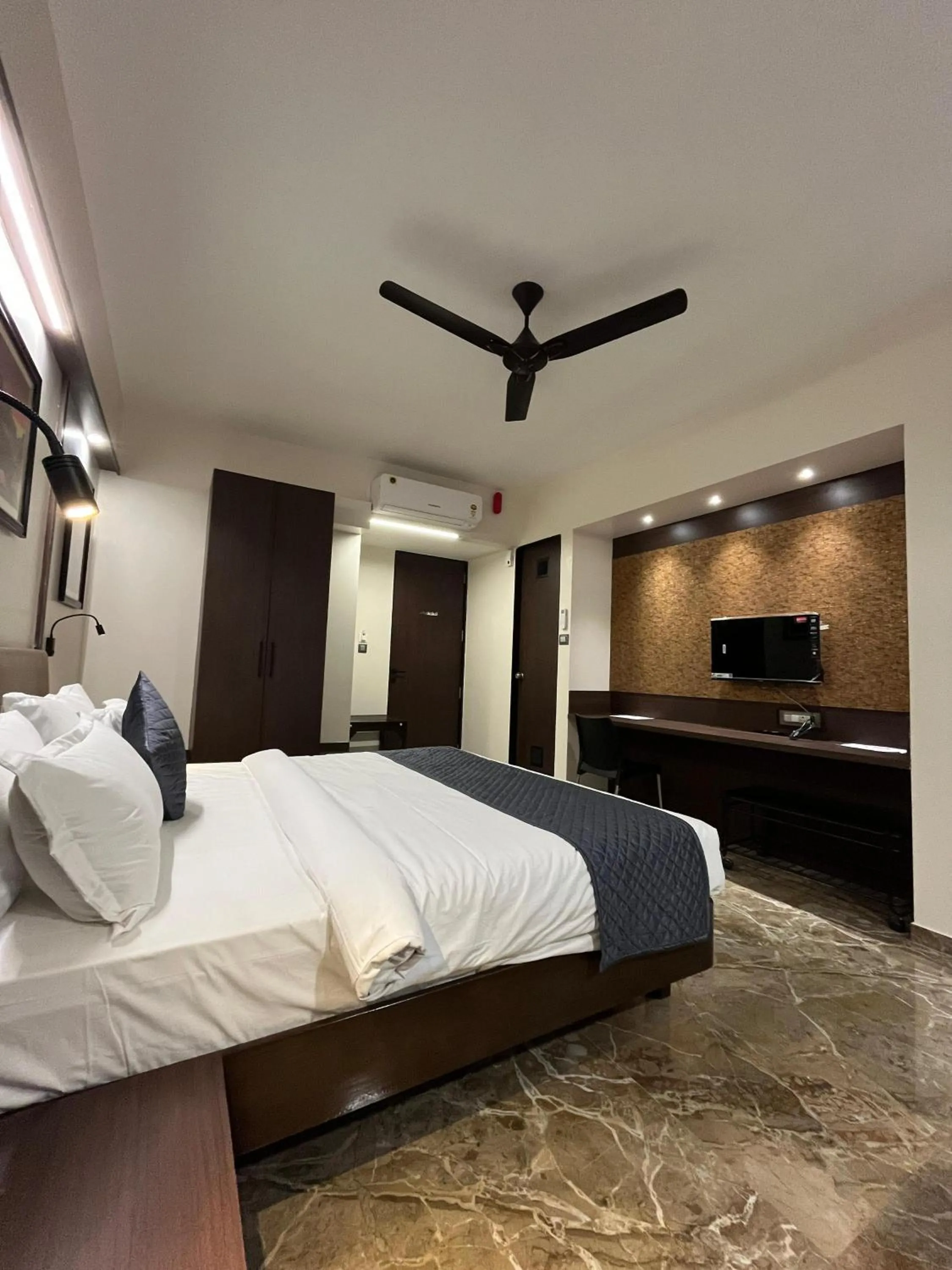 Bed in Kuber Suites