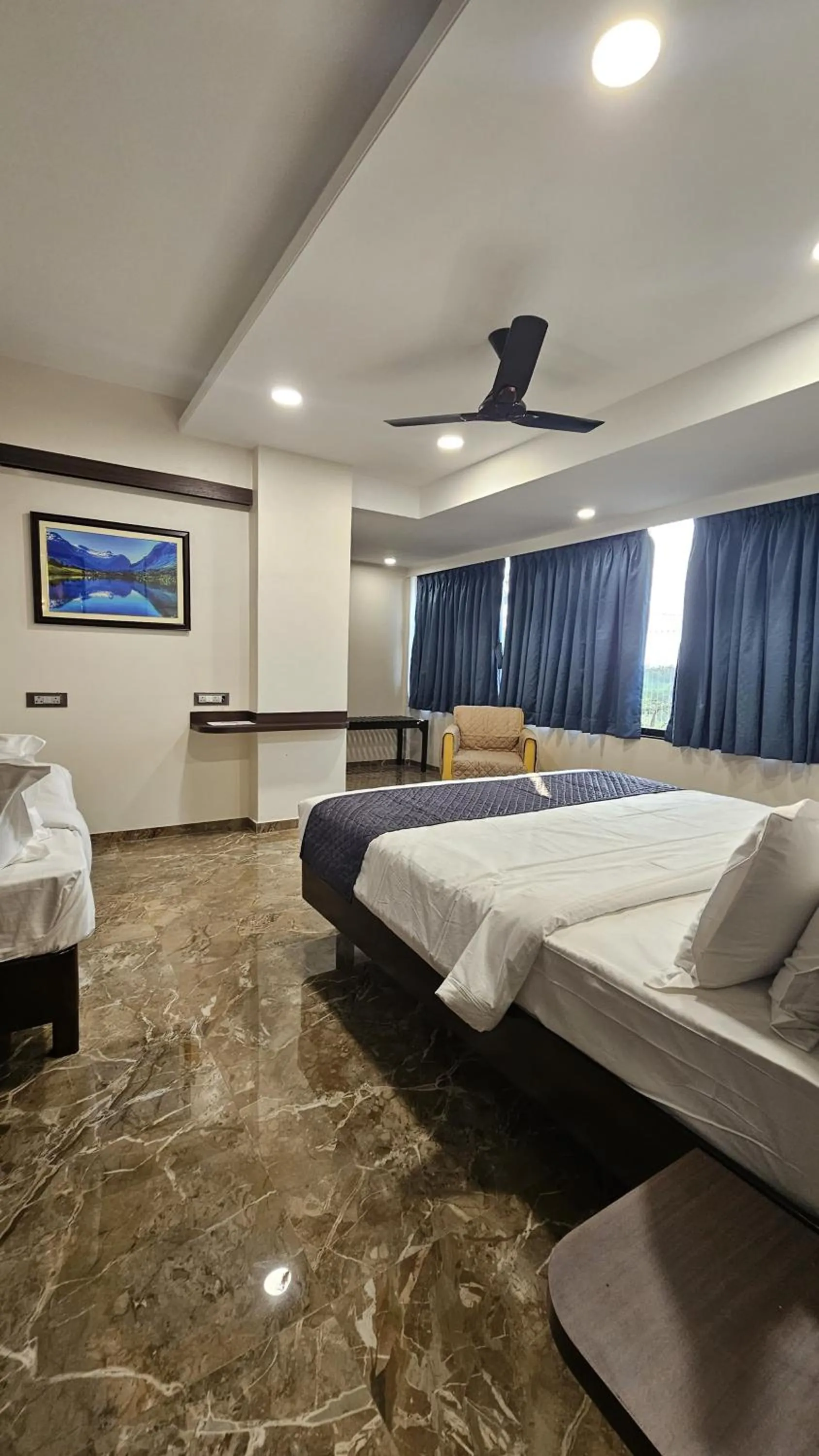 Bed in Kuber Suites