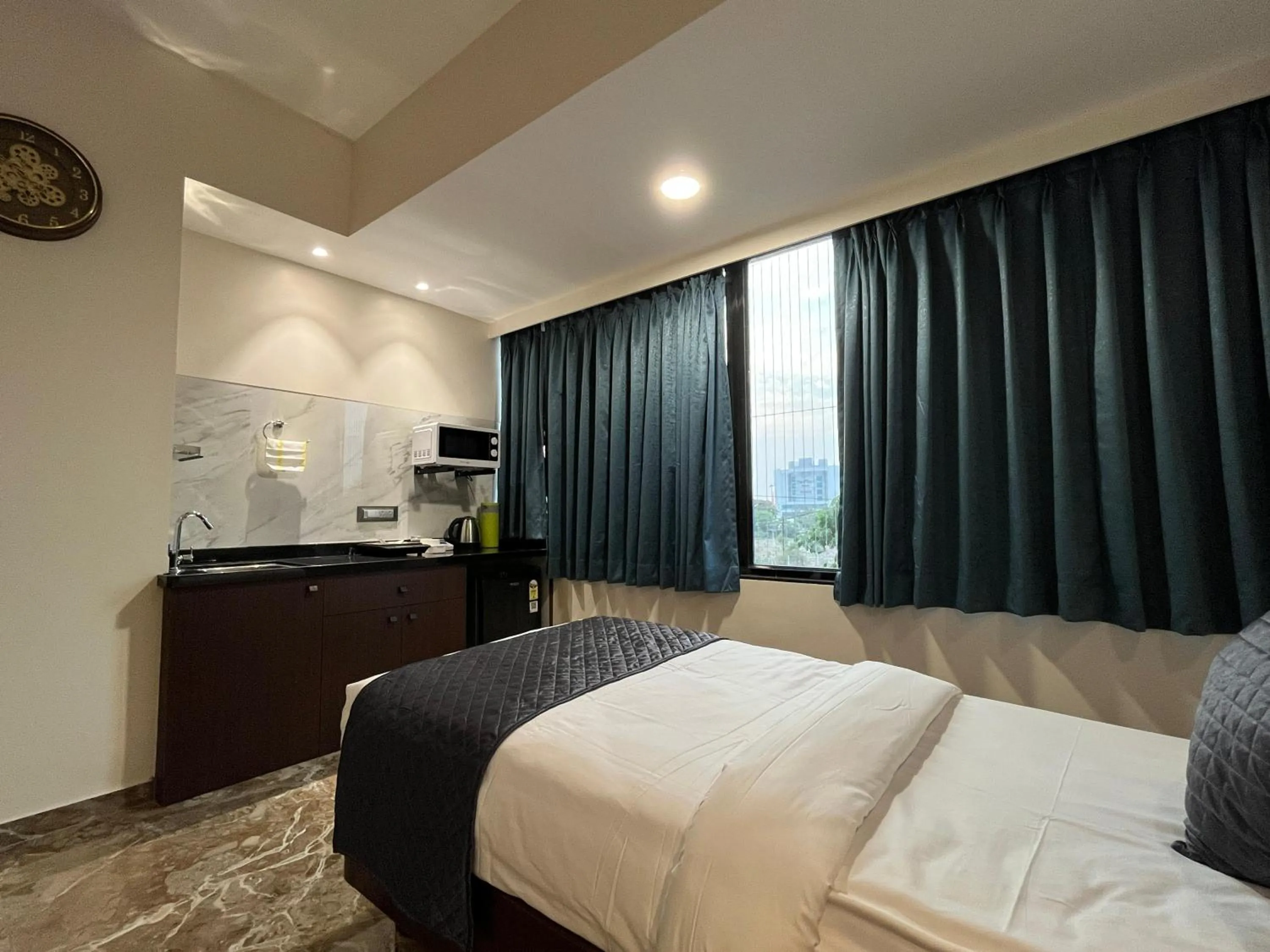 Bed in Kuber Suites