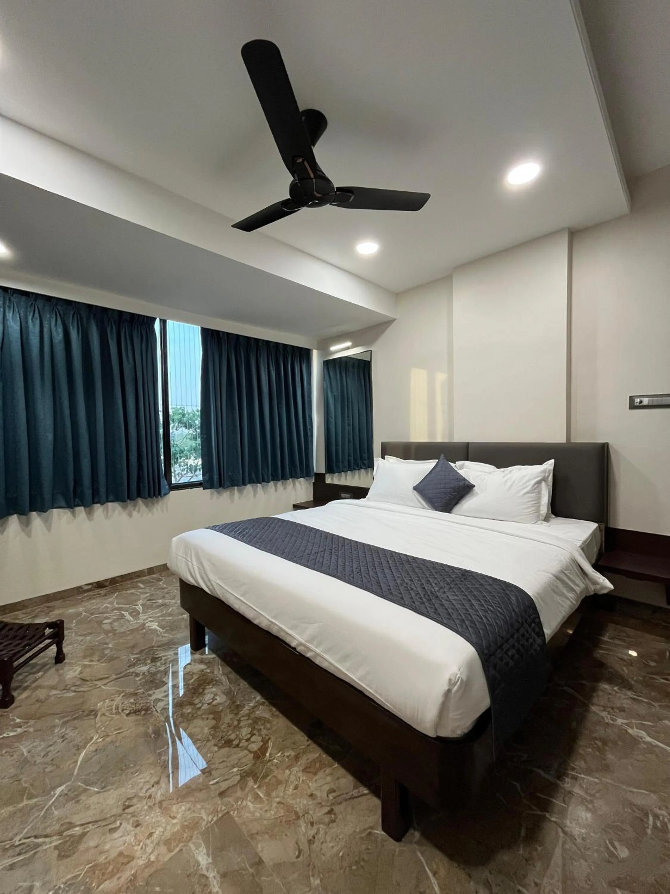 Bed in Kuber Suites