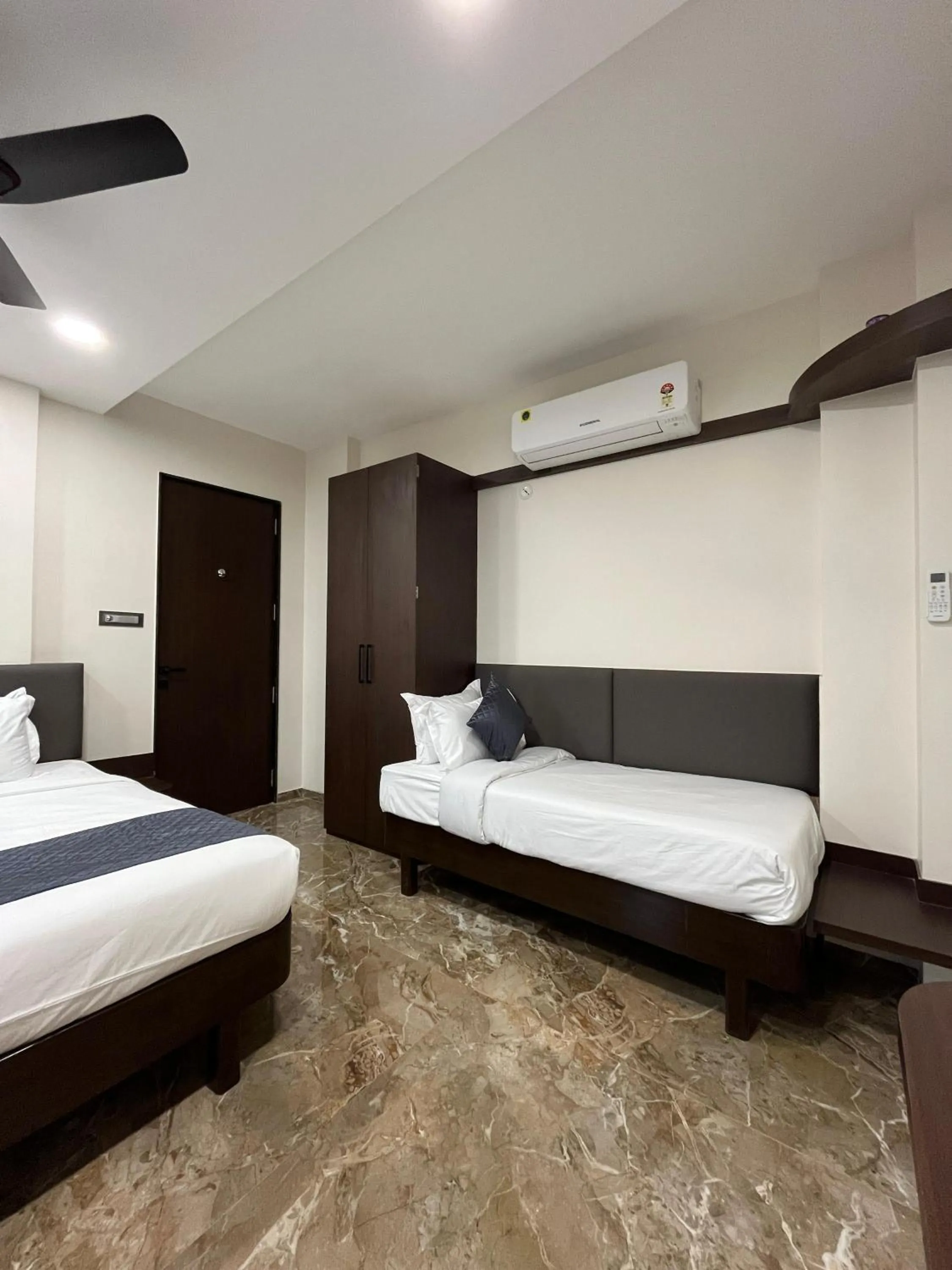 Bed in Kuber Suites