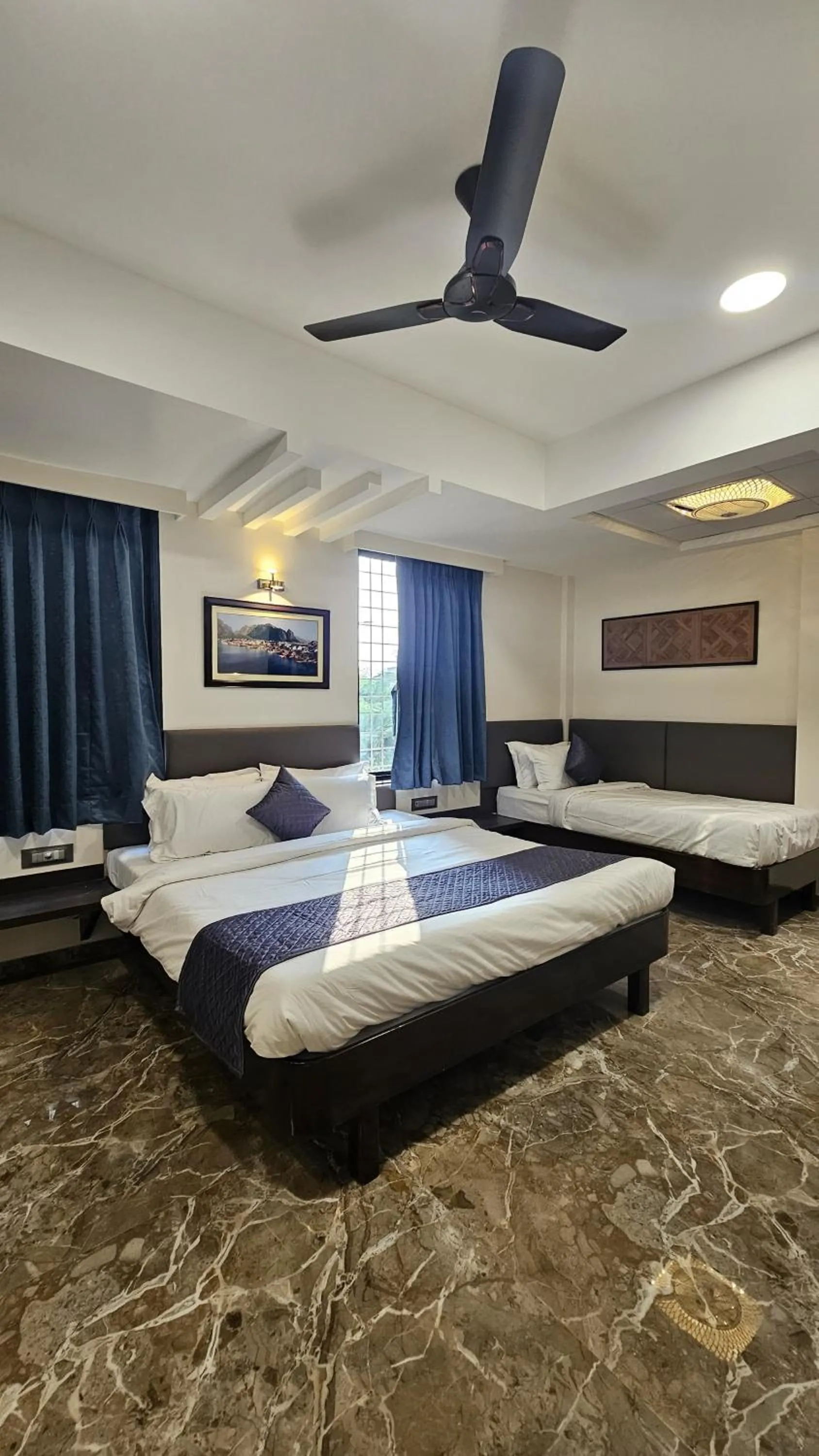 Bed in Kuber Suites