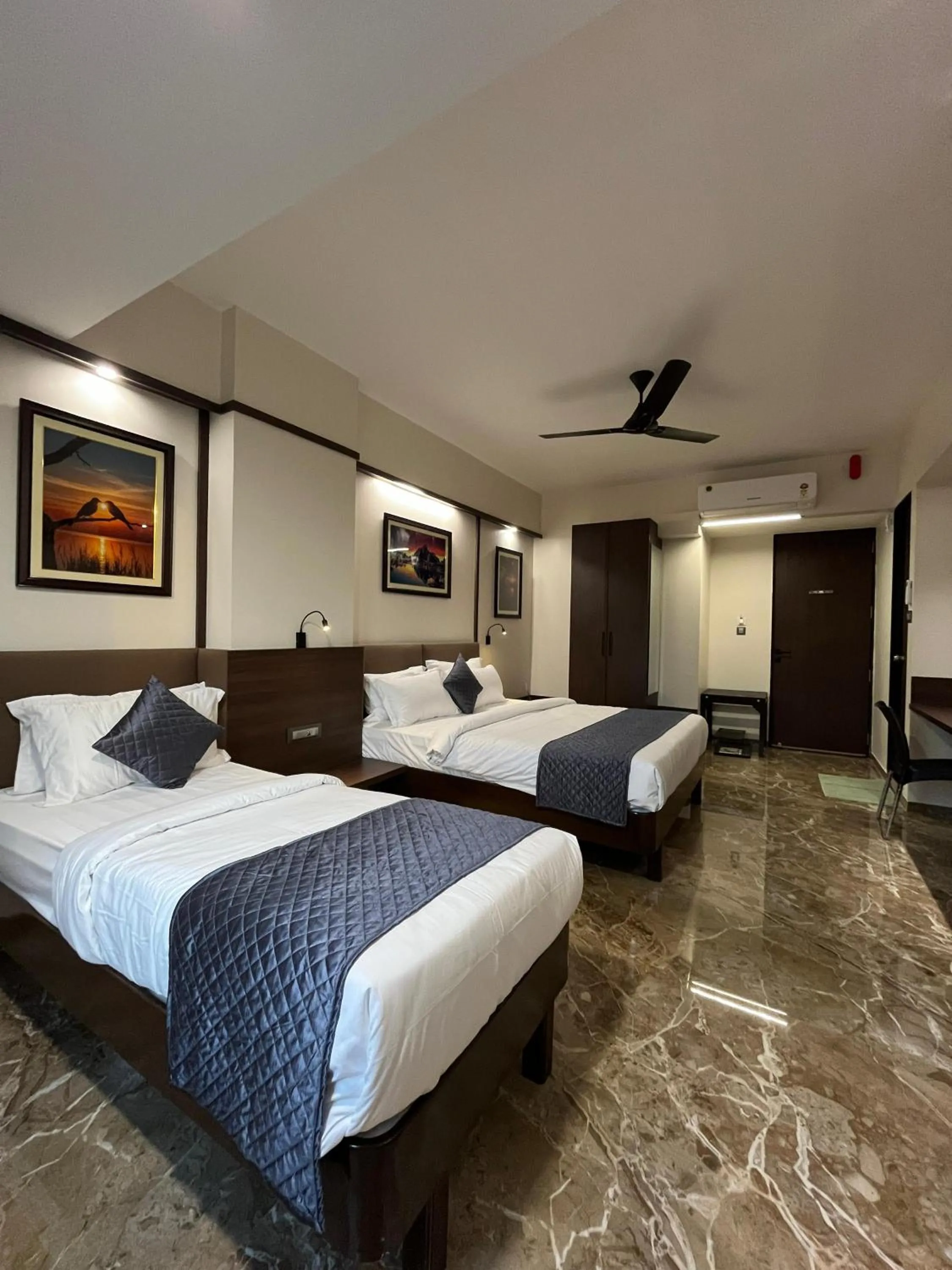 Bed in Kuber Suites
