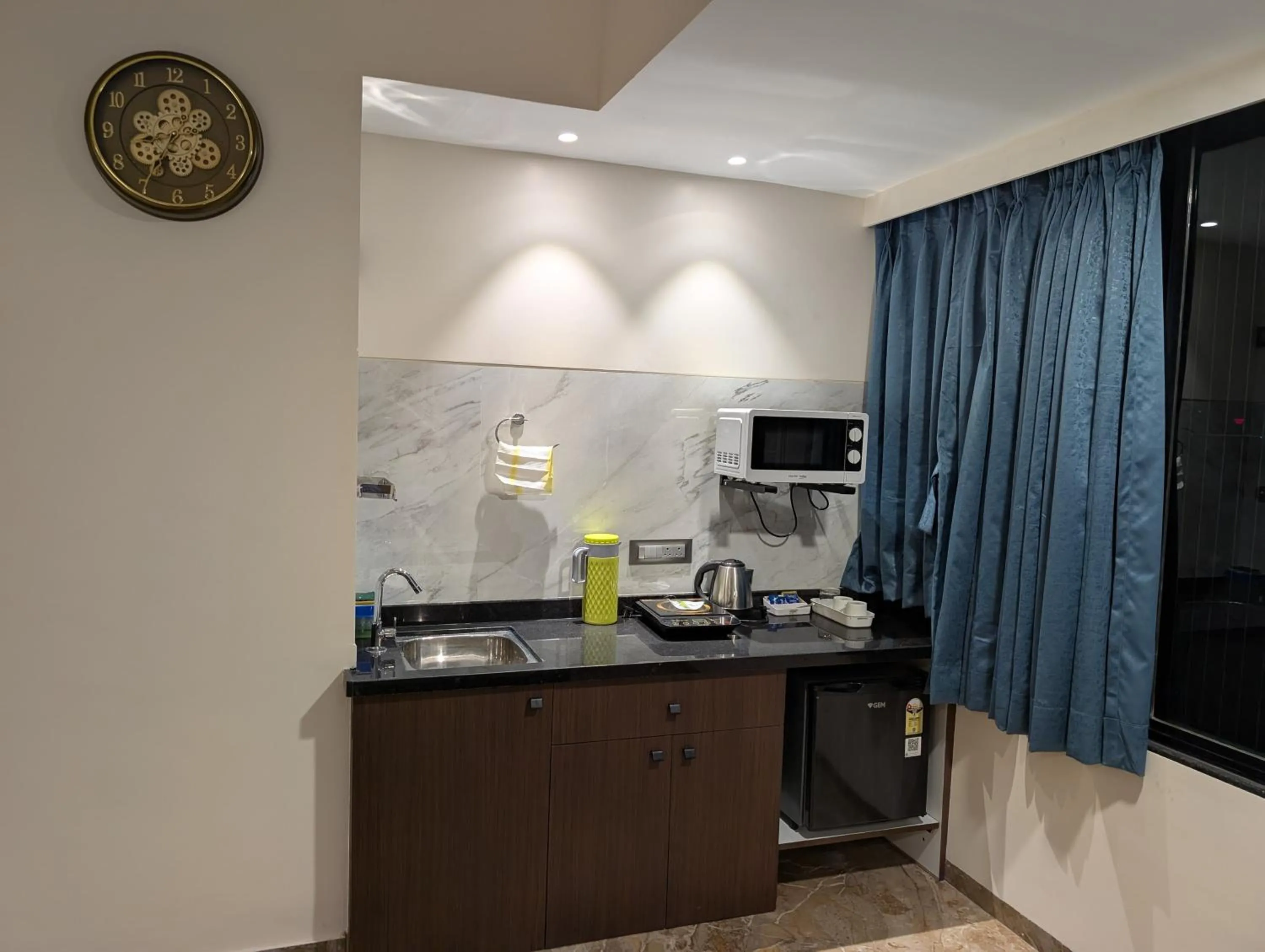 Kitchen or kitchenette in Kuber Suites