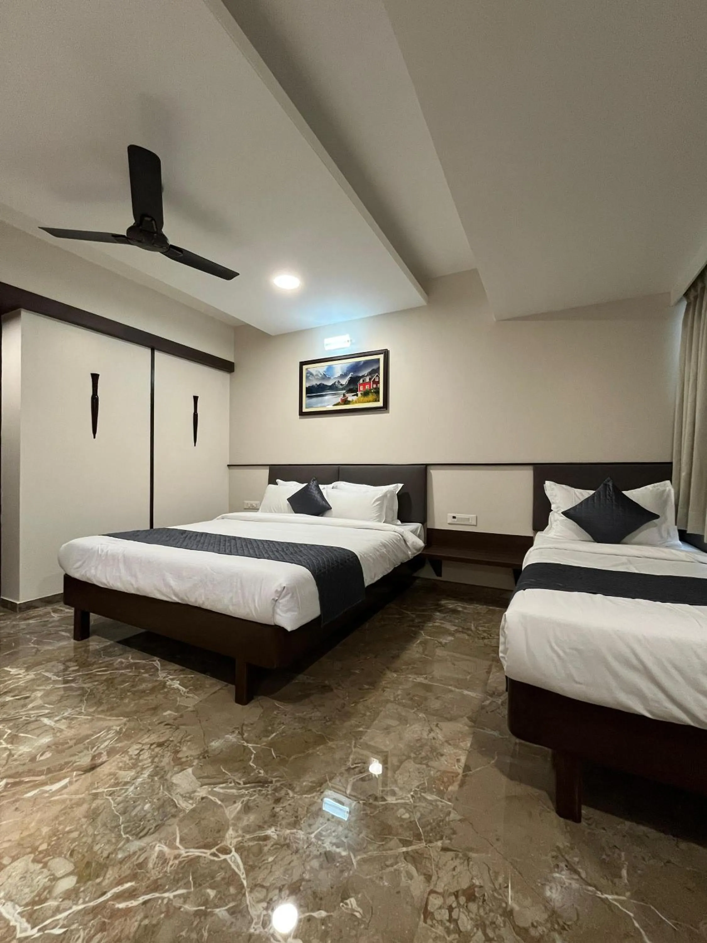 Bed in Kuber Suites