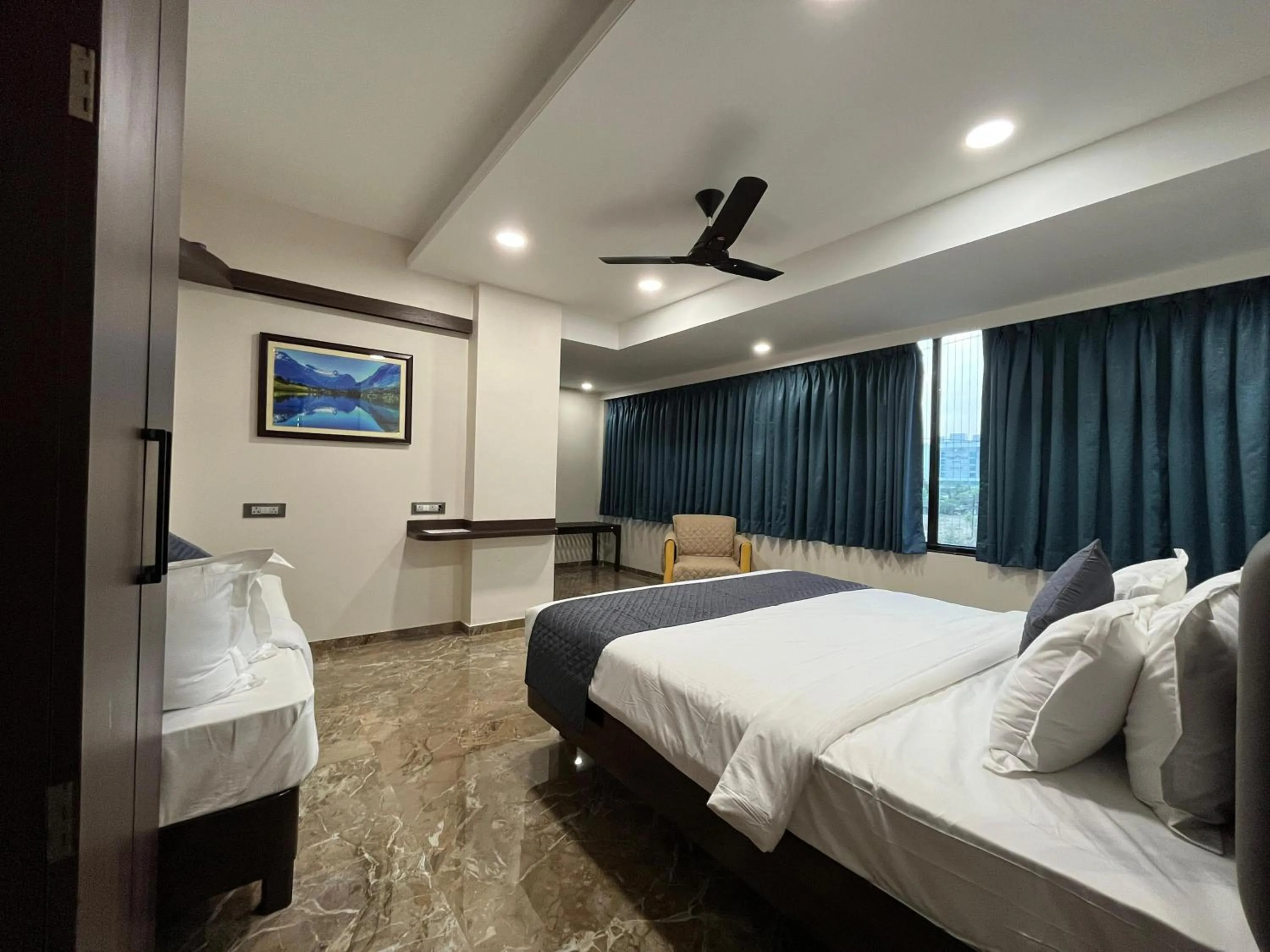 Bed in Kuber Suites
