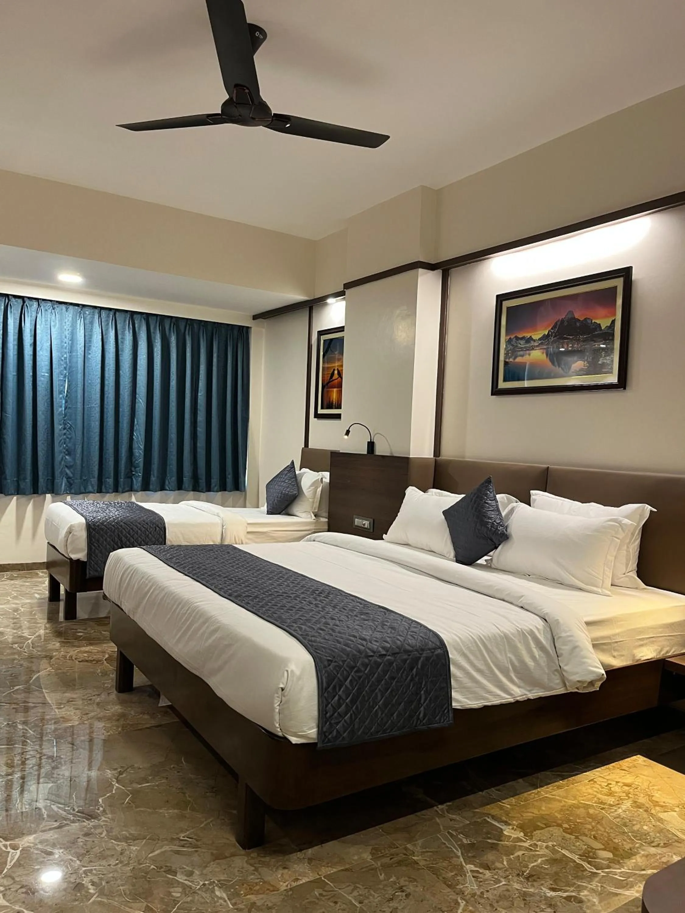 Bed in Kuber Suites