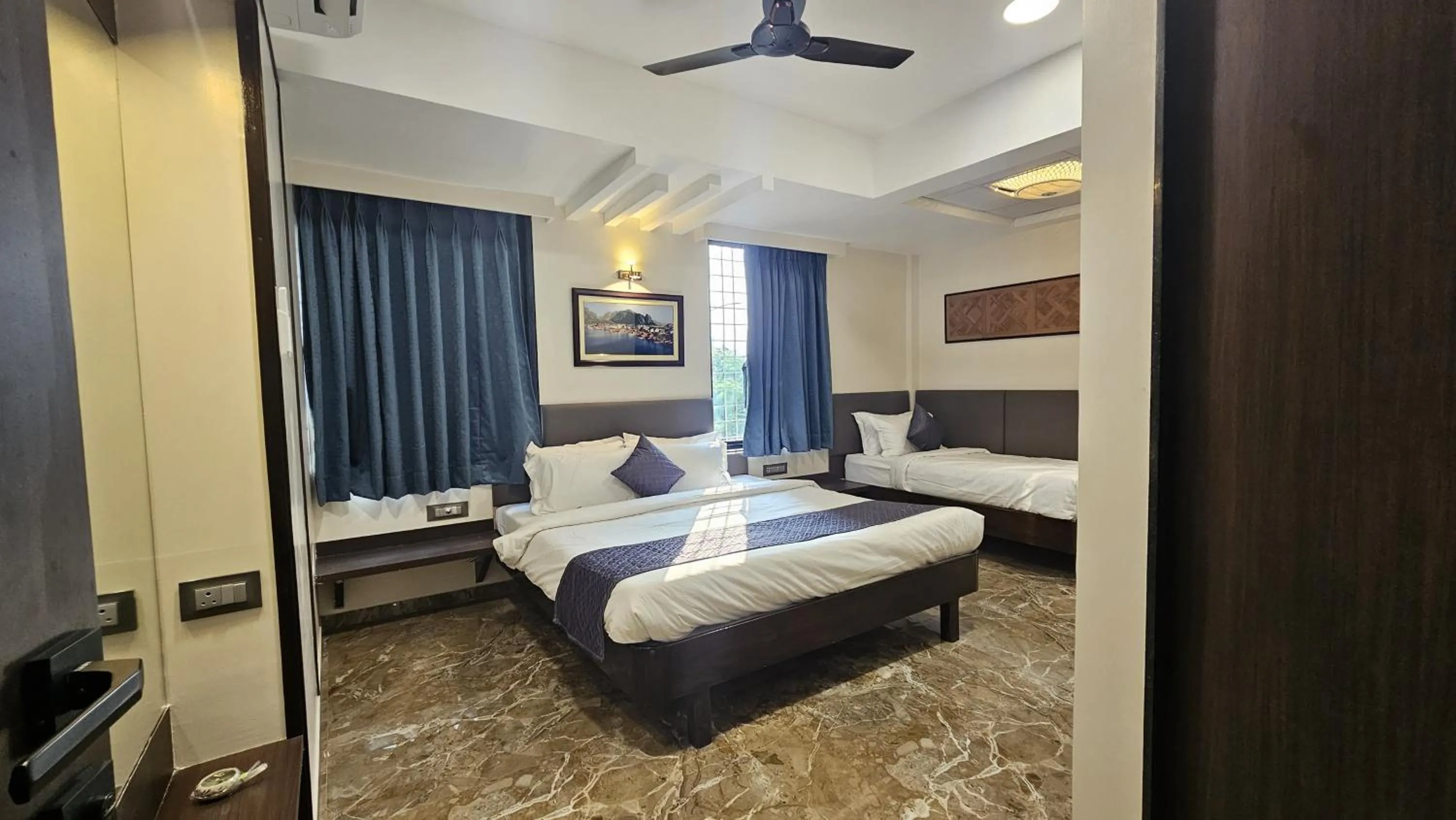 Bed in Kuber Suites