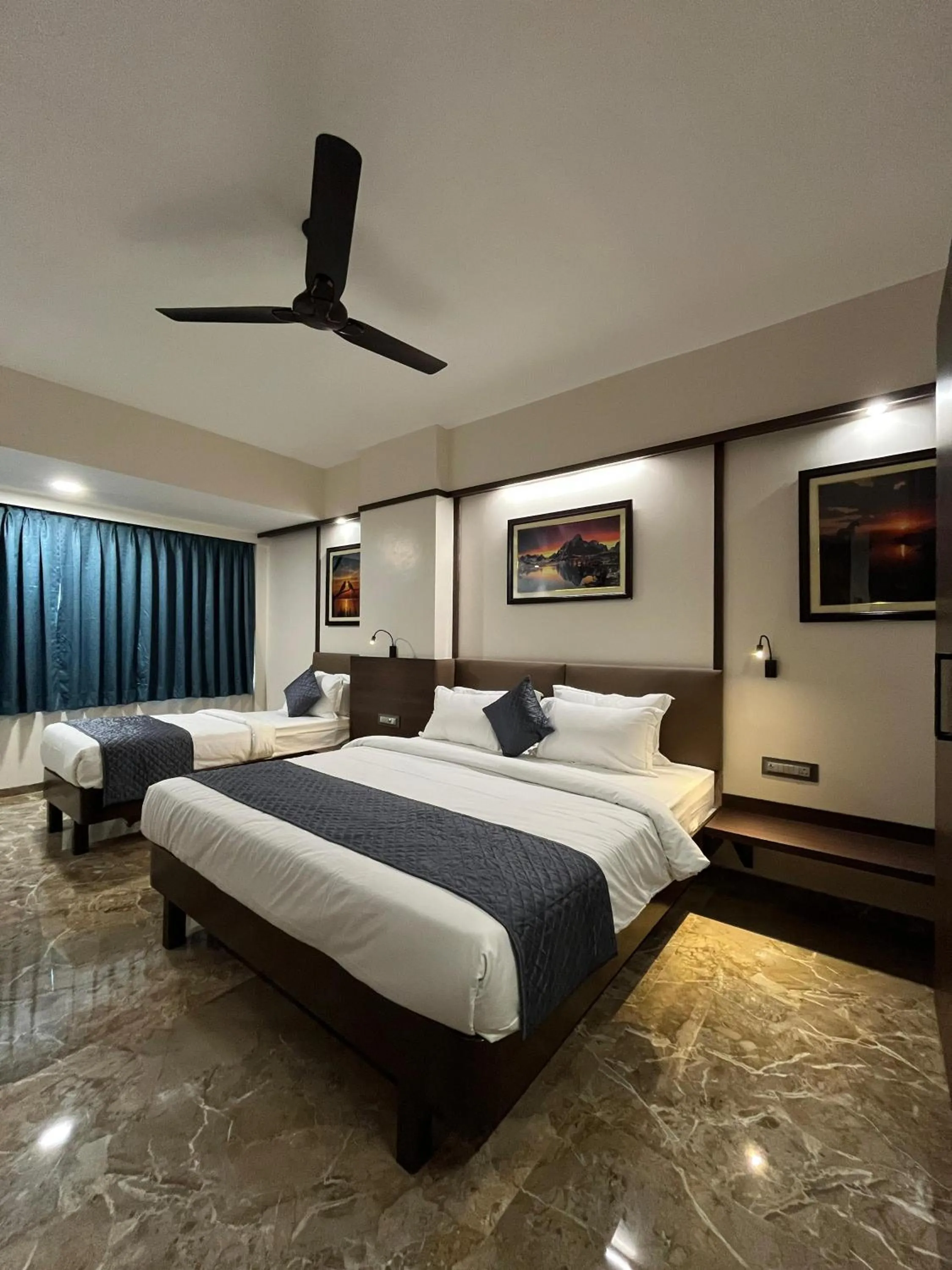Bed in Kuber Suites