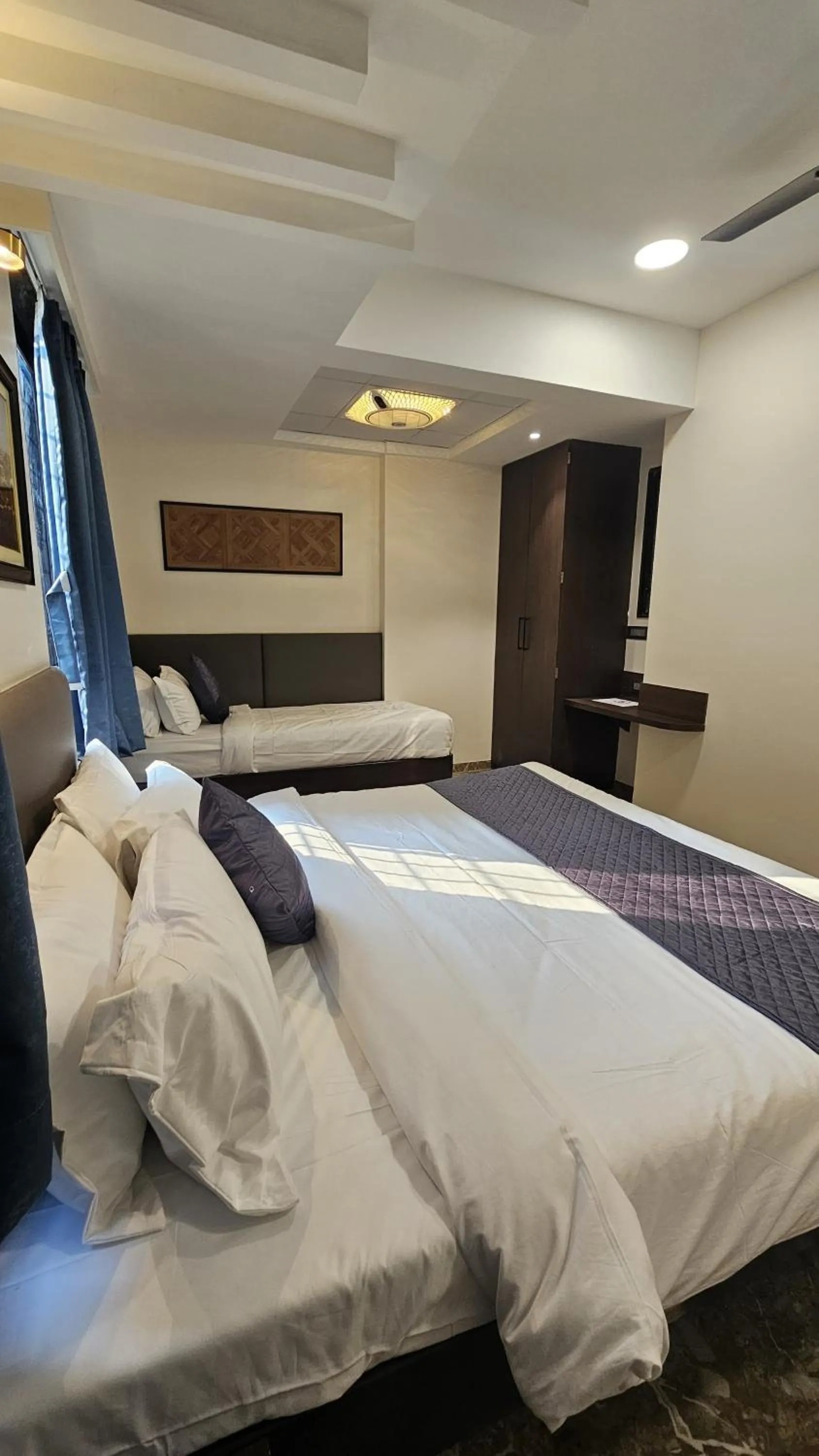 Bed in Kuber Suites