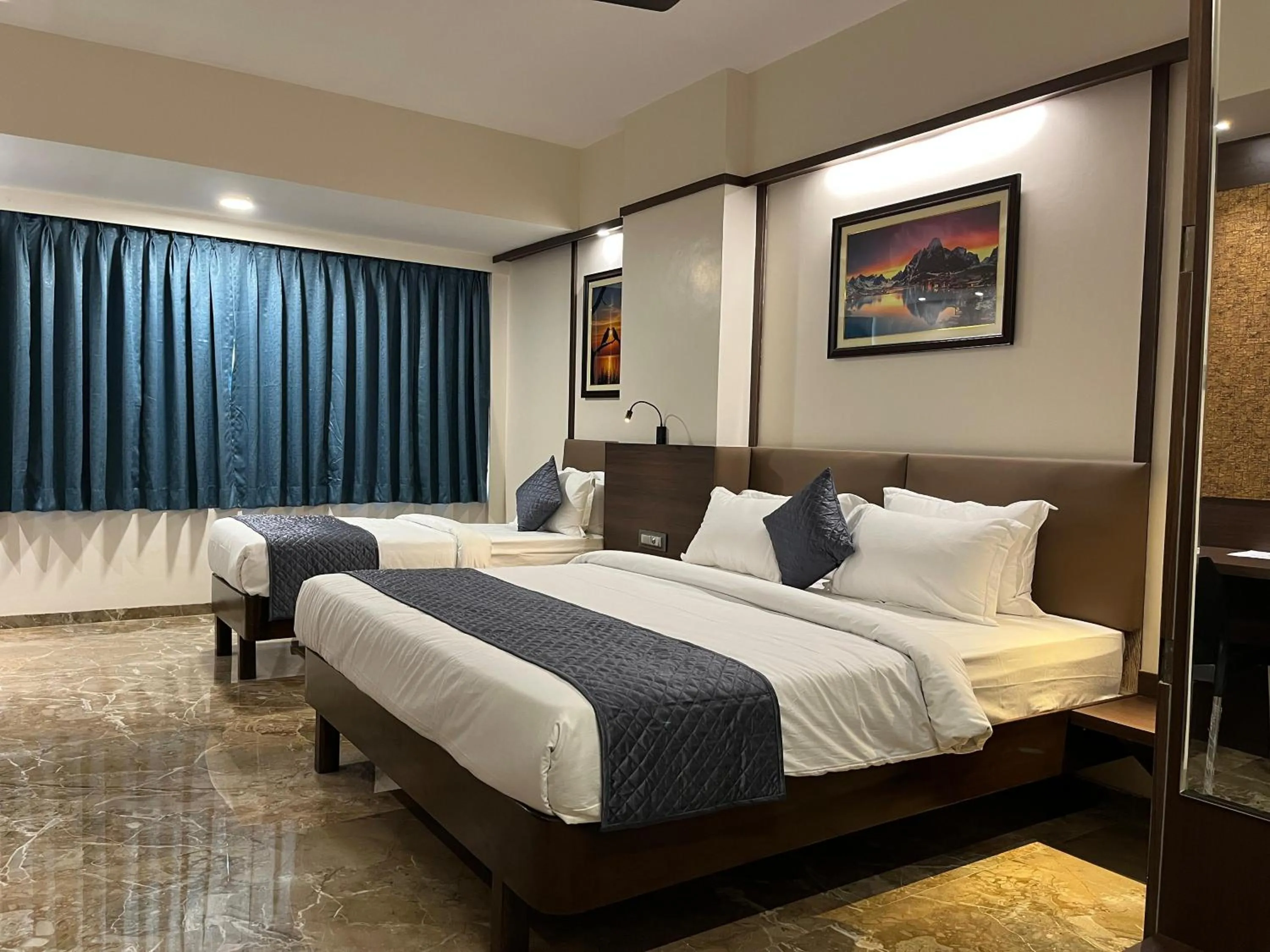 Bed in Kuber Suites