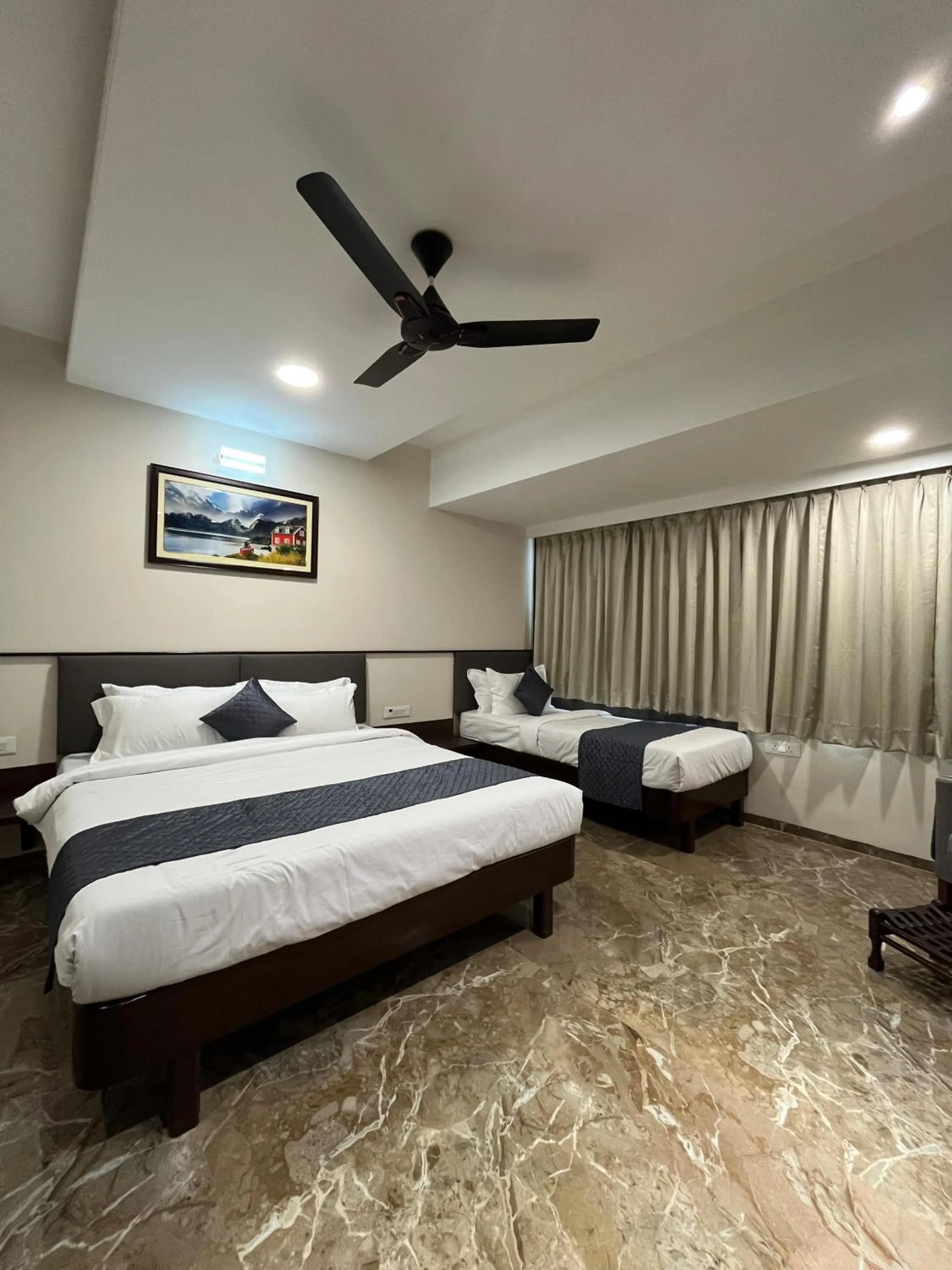 Bed in Kuber Suites