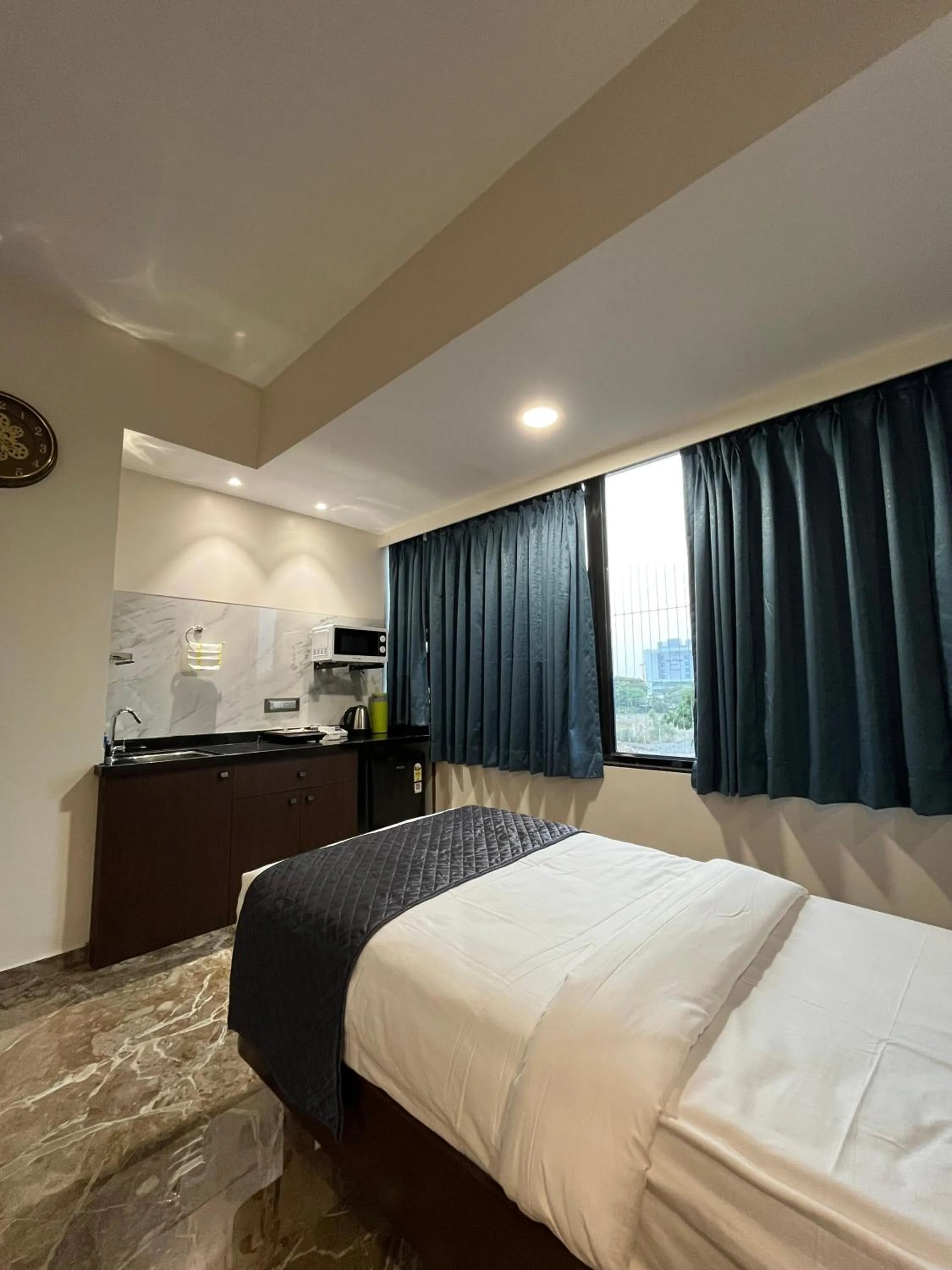 Bed in Kuber Suites