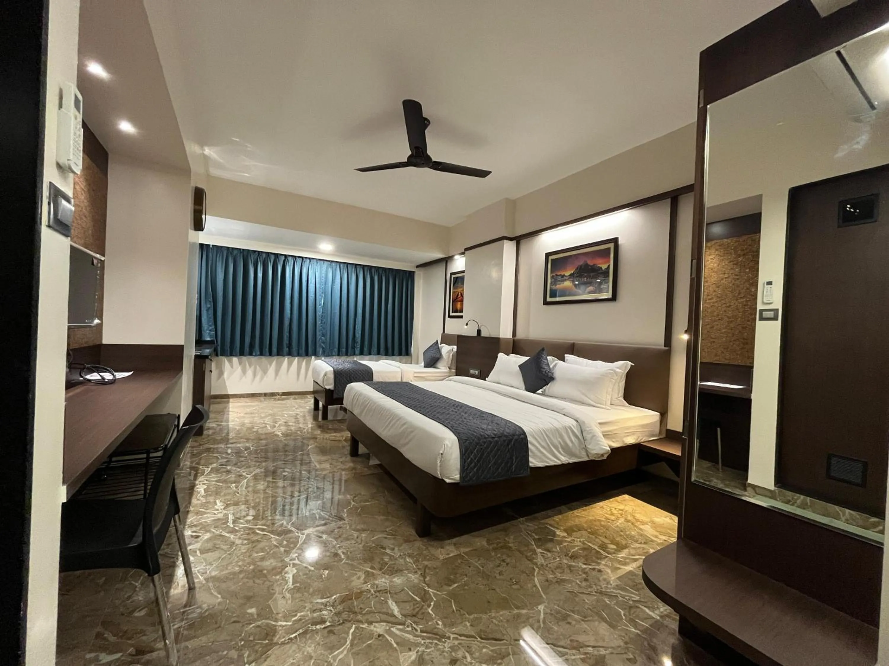 Bed in Kuber Suites