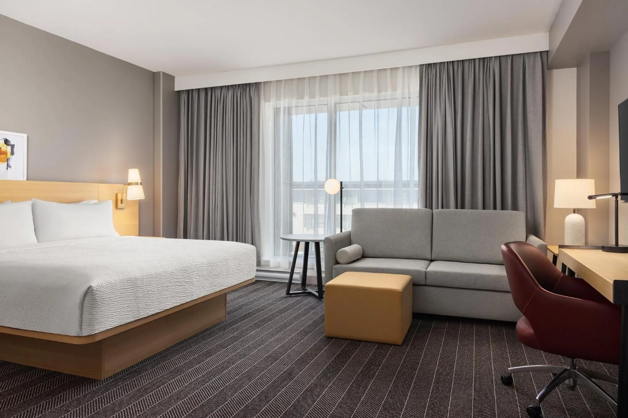 Photo of the whole room, Bed in Staybridge Suites Montreal Airport - St-Laurent by IHG