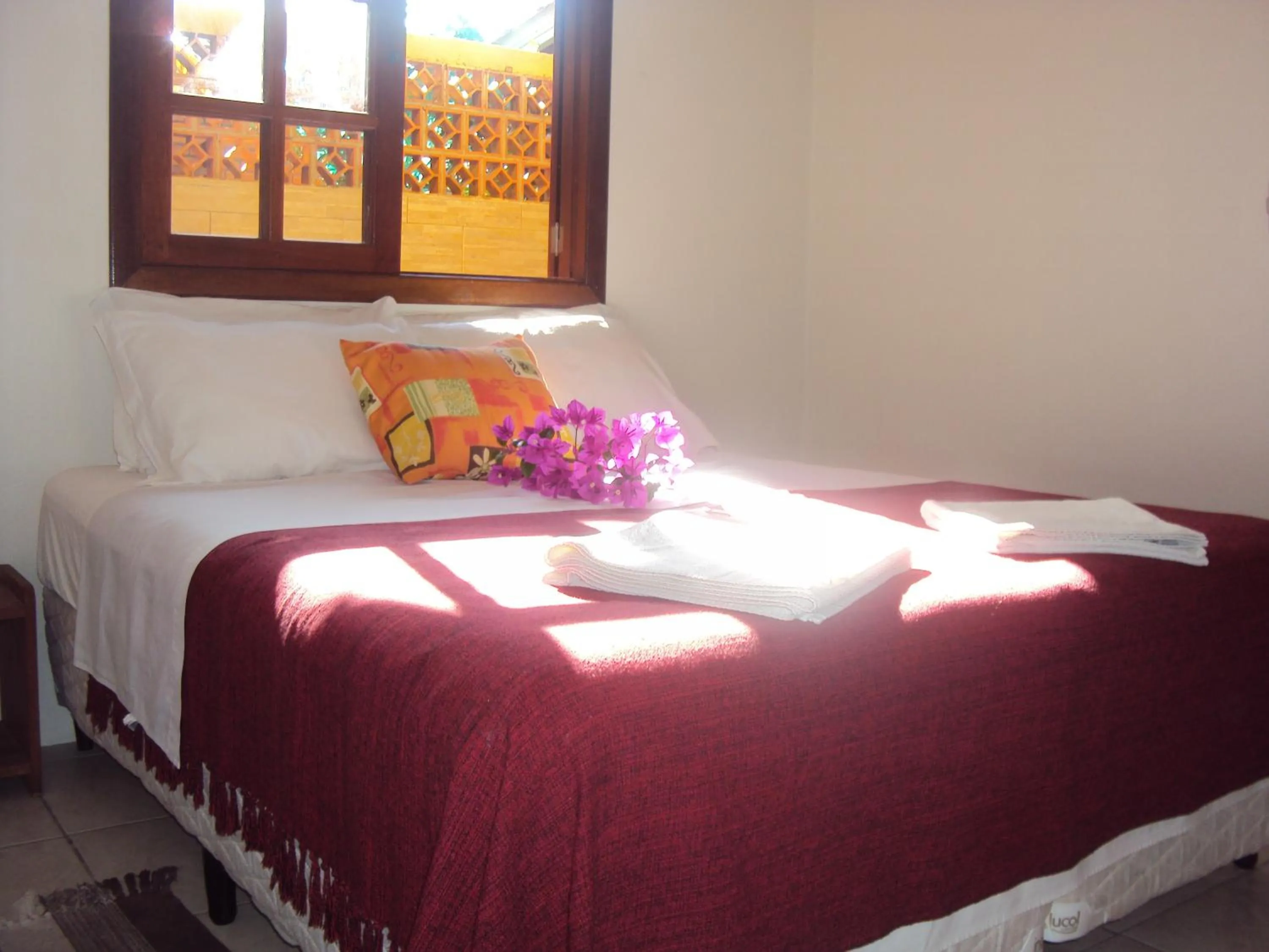 Bed in Pousada do Paraiso