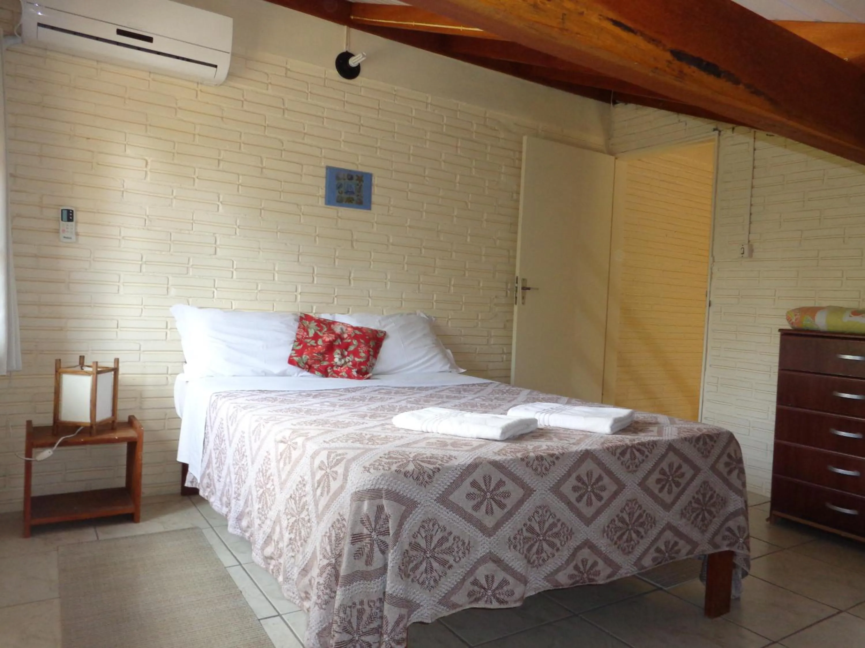 Bed in Pousada do Paraiso