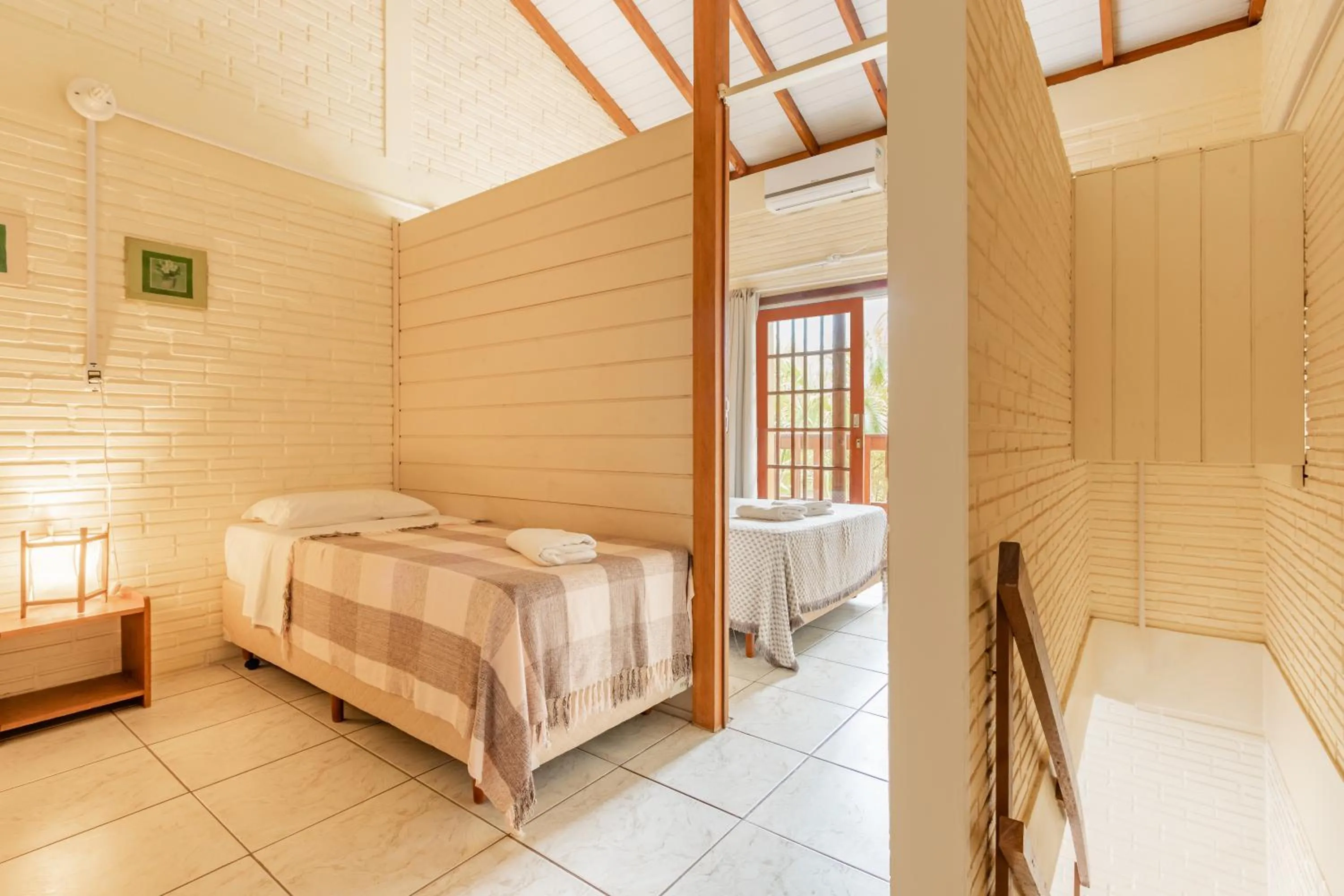 Bed in Pousada do Paraiso