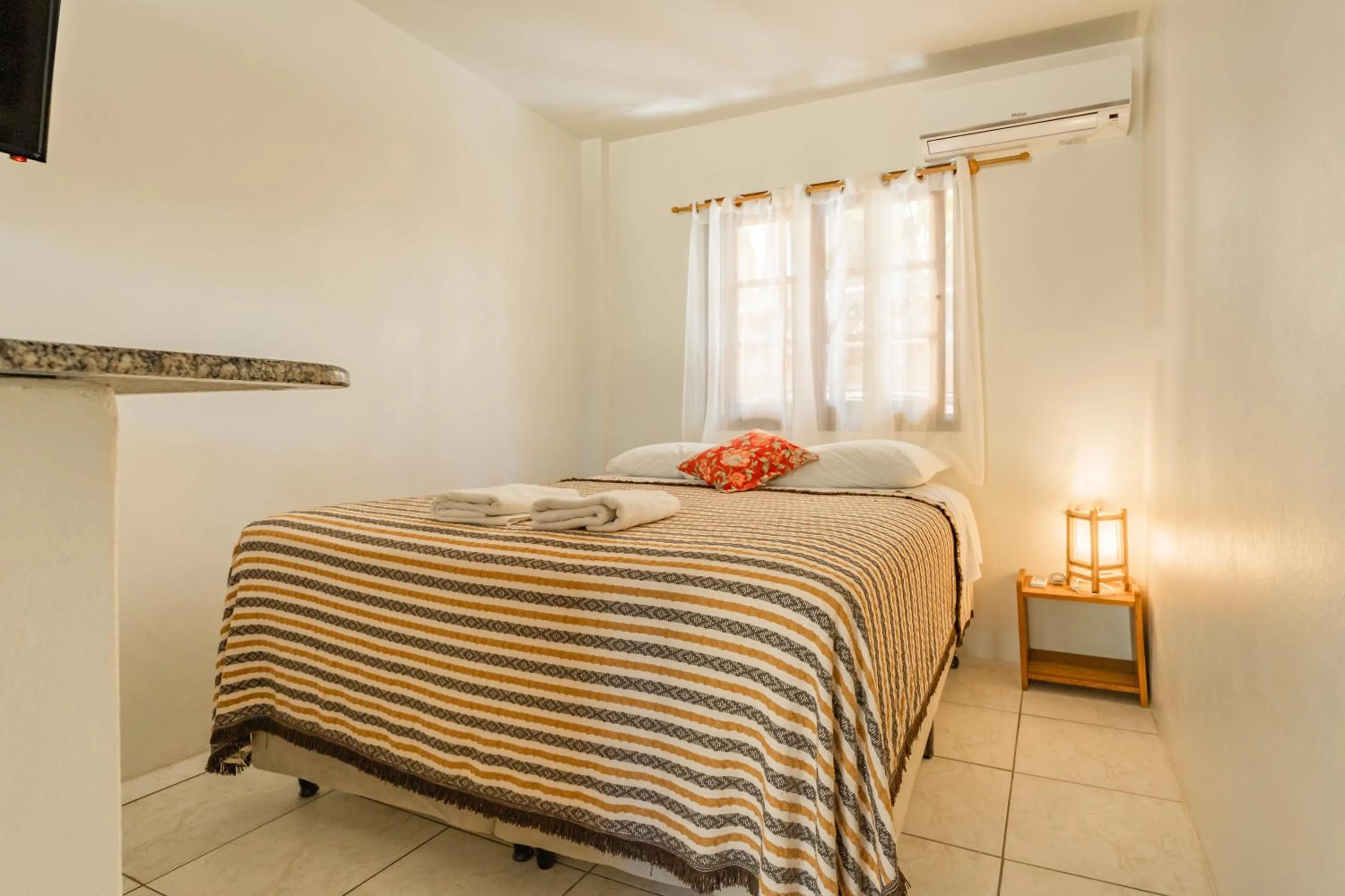 Bed in Pousada do Paraiso