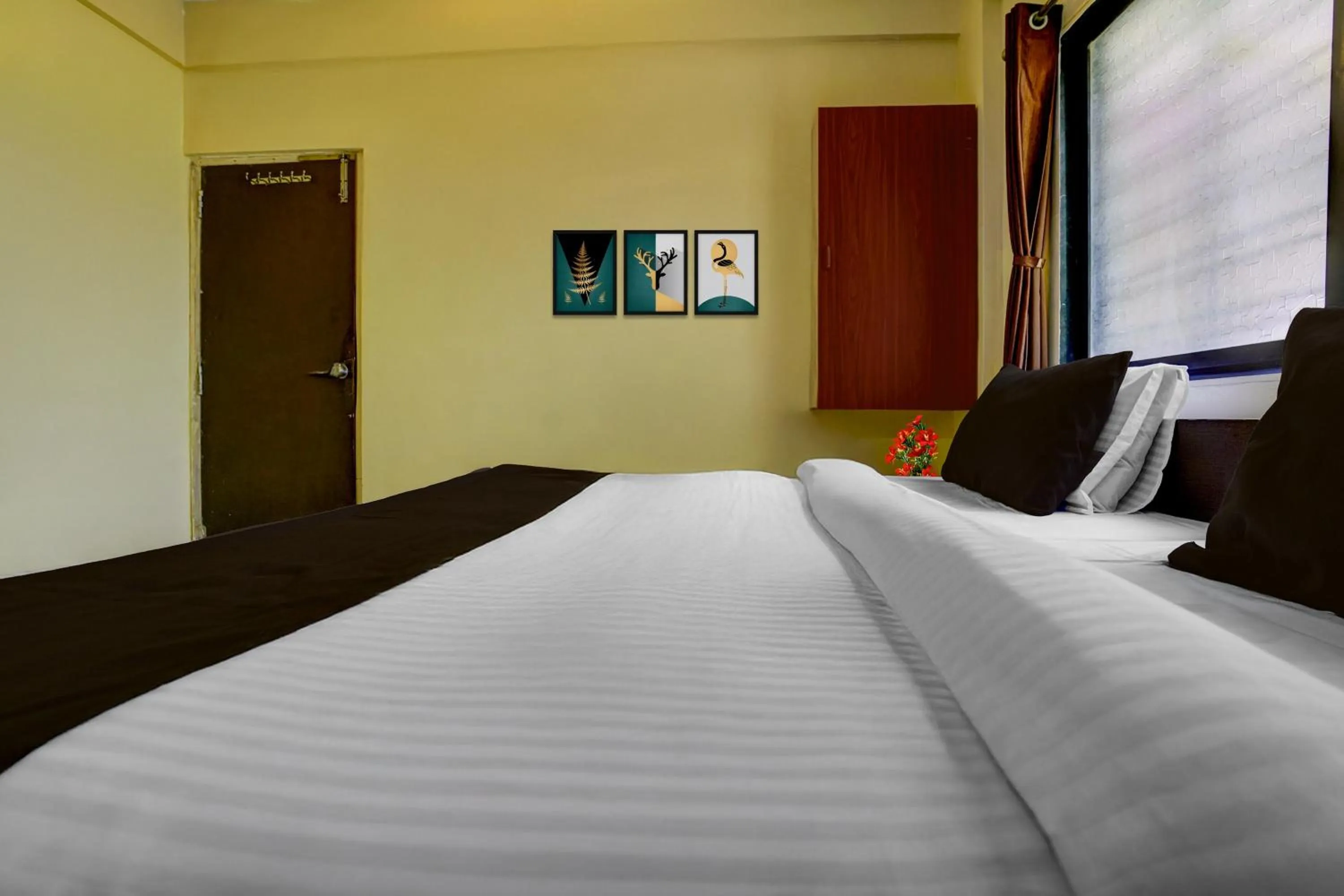 Bedroom, Bed in Hotel O Sainagar Shirdi Railway Junction Formerly Sai Vyankatesh Residency