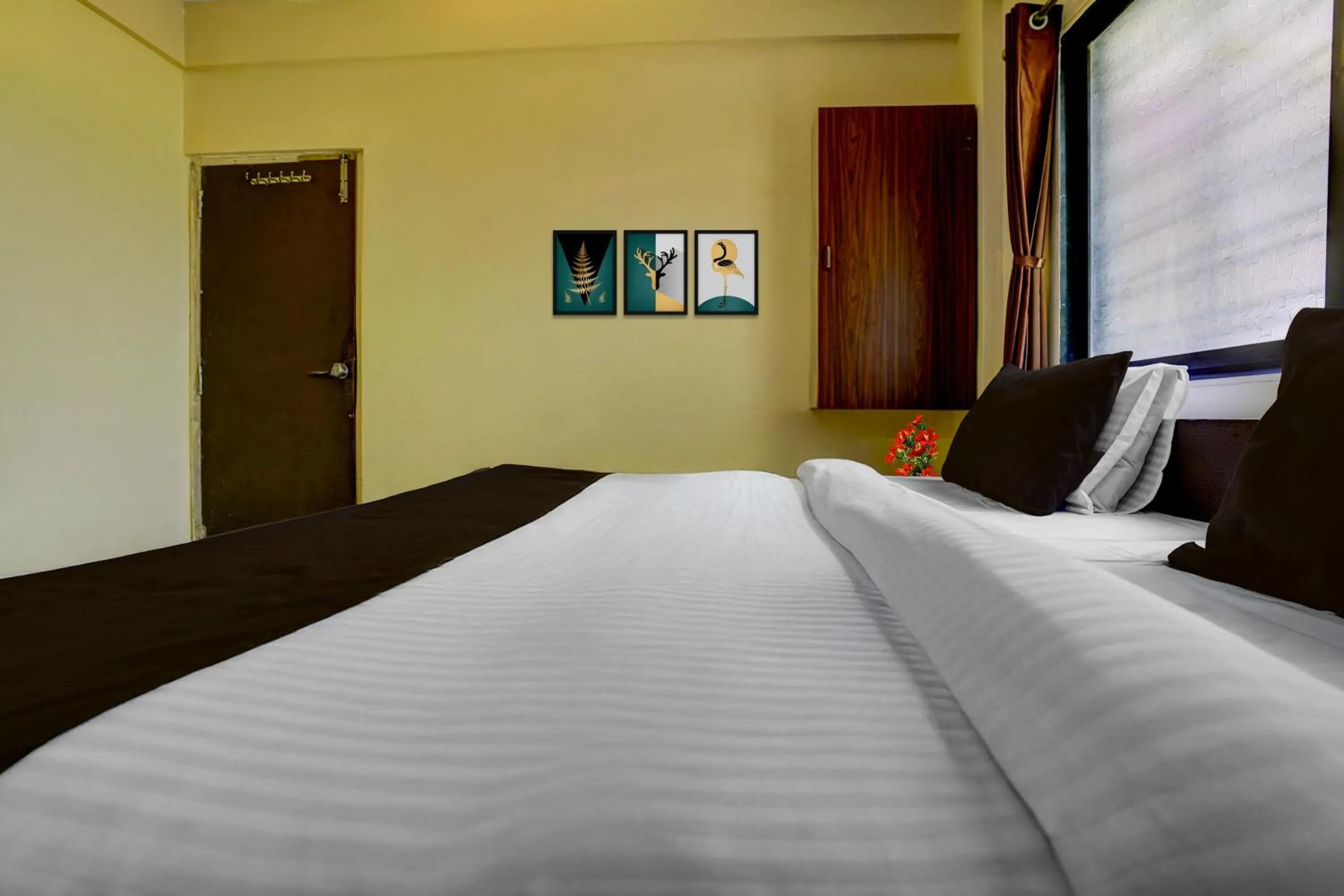 Bedroom, Bed in Super Hotel O Sainagar Shirdi Railway Junction Formerly Sai Vyankatesh Residency