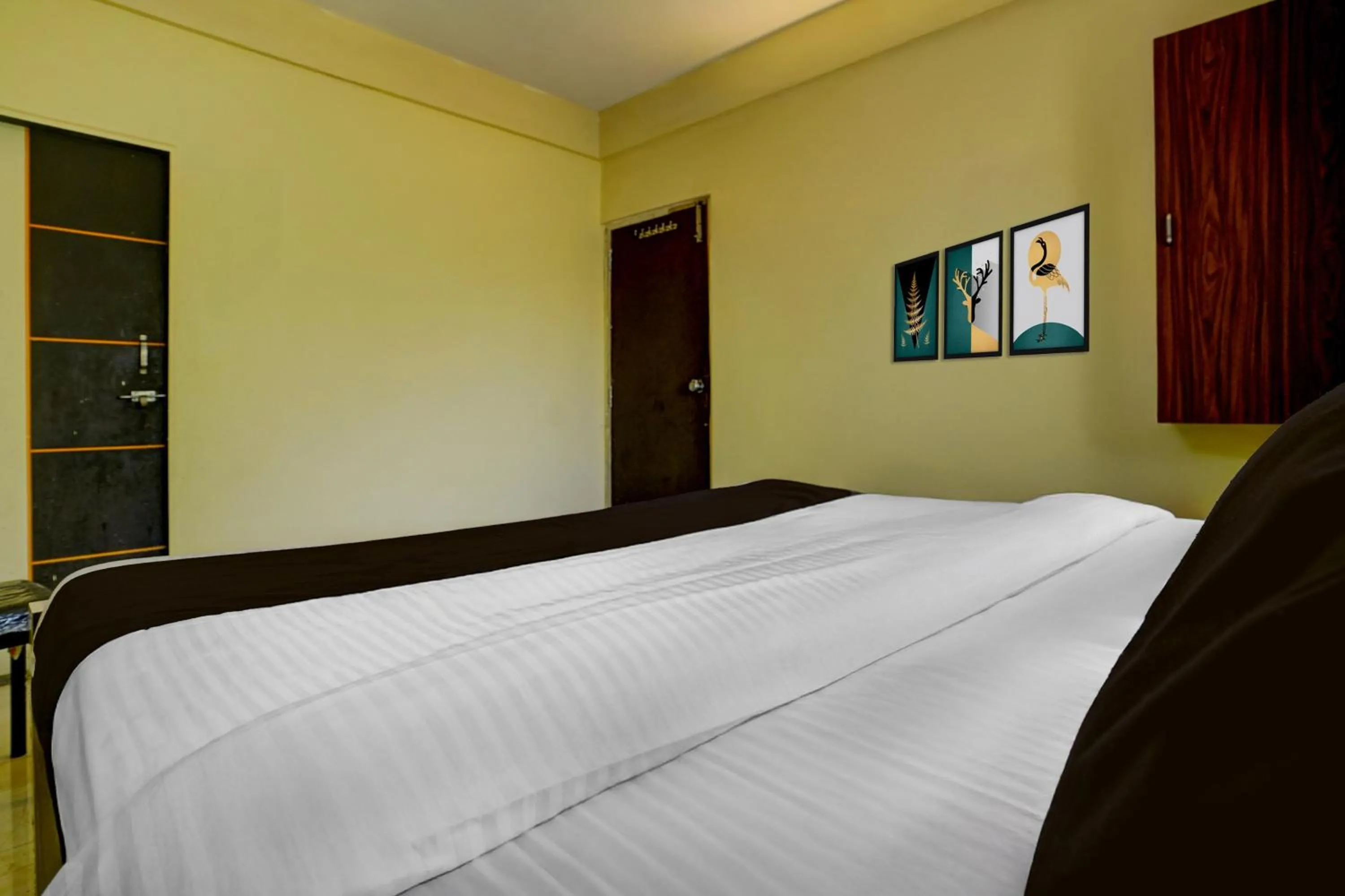 Bedroom, Bed in Hotel O Sainagar Shirdi Railway Junction Formerly Sai Vyankatesh Residency