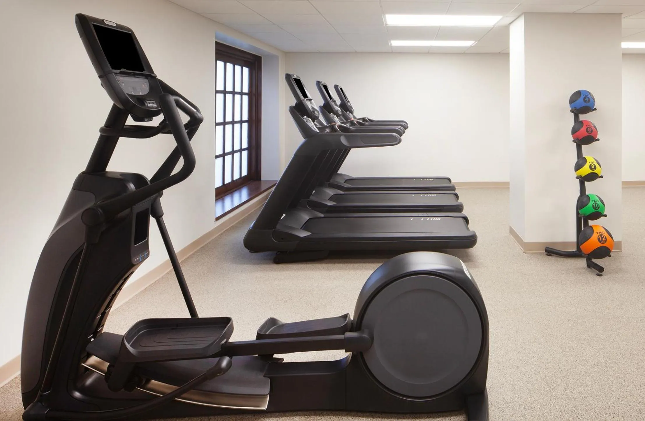 Fitness centre/facilities in Hotel Royer Urbana Champaign, Tapestry Collection by Hilton