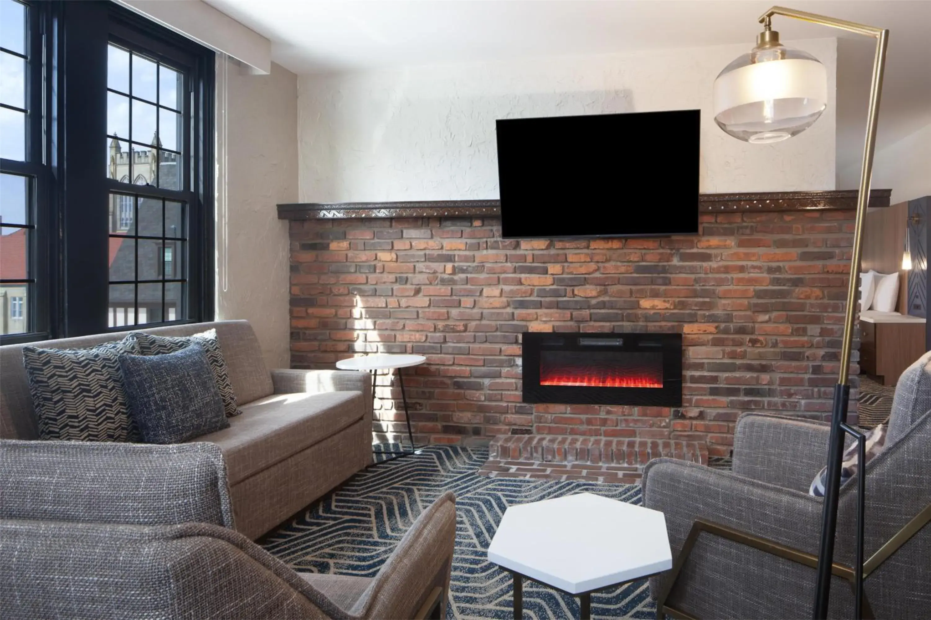 King Studio Suite with Fireplace in Hotel Royer Urbana Champaign, Tapestry Collection by Hilton King Studio Suite with Fireplace in Hotel Royer Urbana Champaign, Tapestry Collection by Hilton