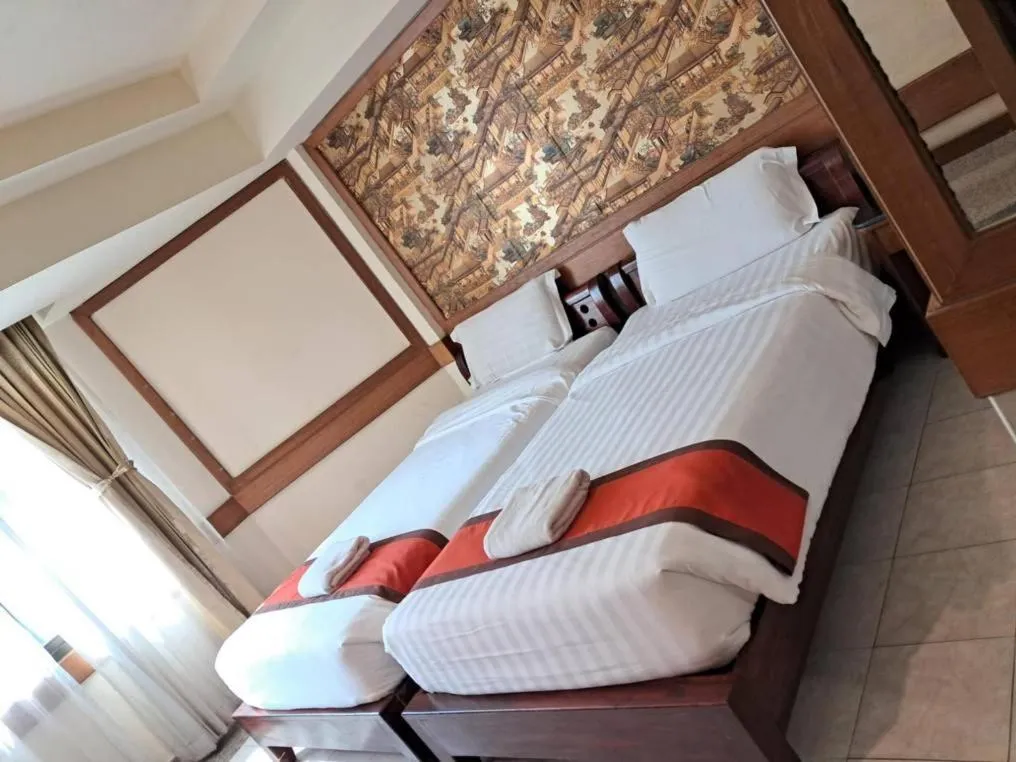 Bed in Boutique Paradise Hotel