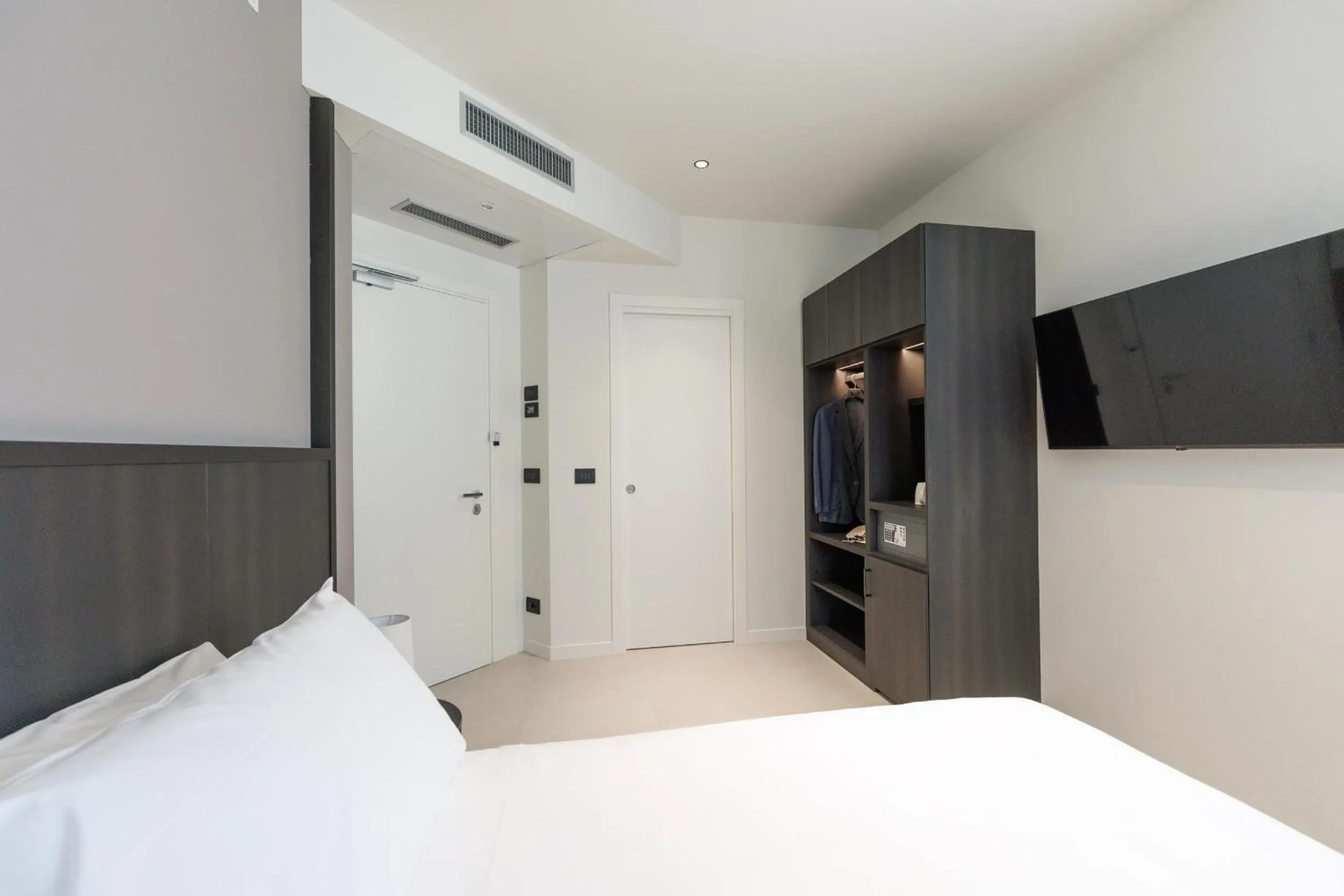Bed in Hotel Stelvio Tirano