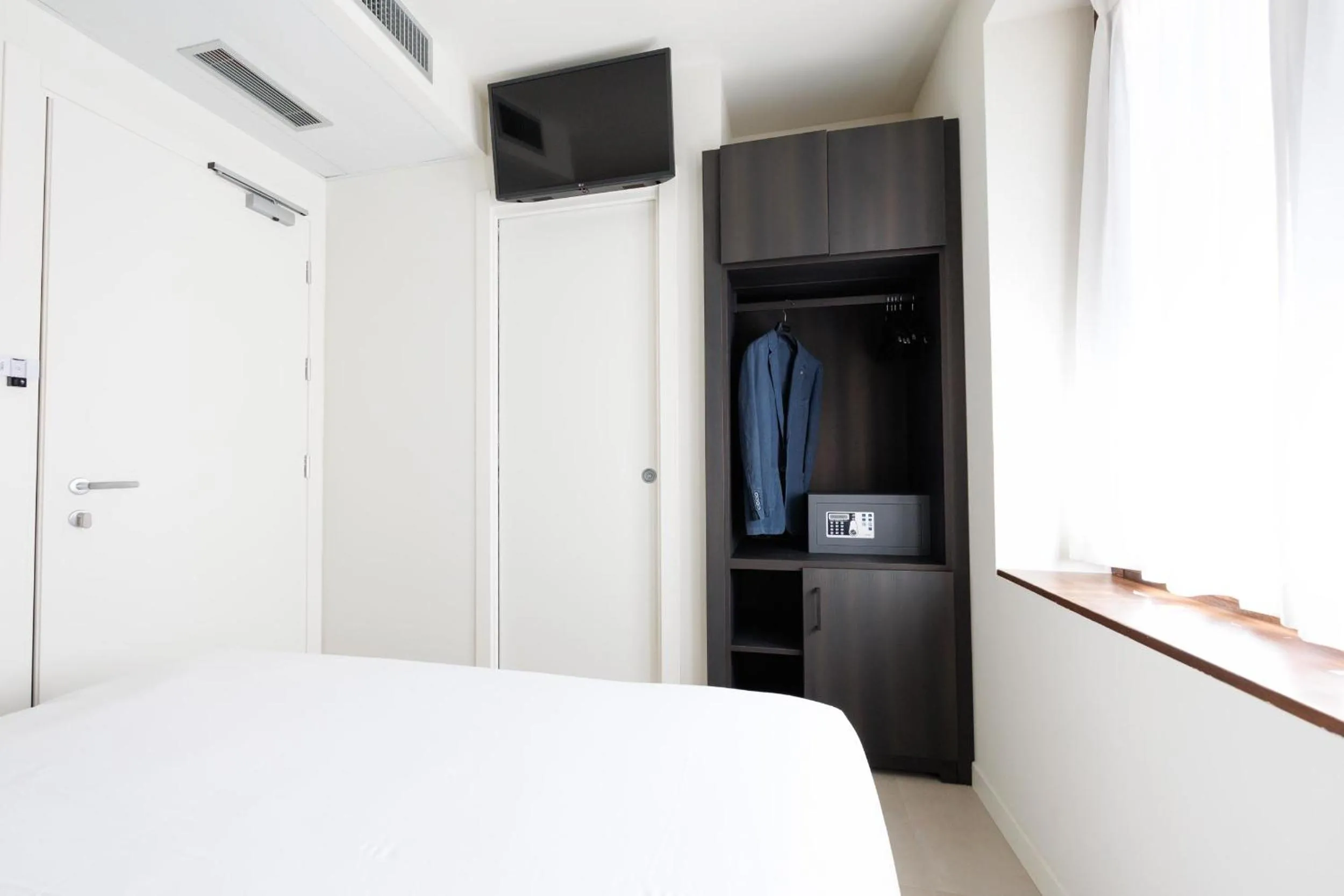 Bed in Hotel Stelvio Tirano