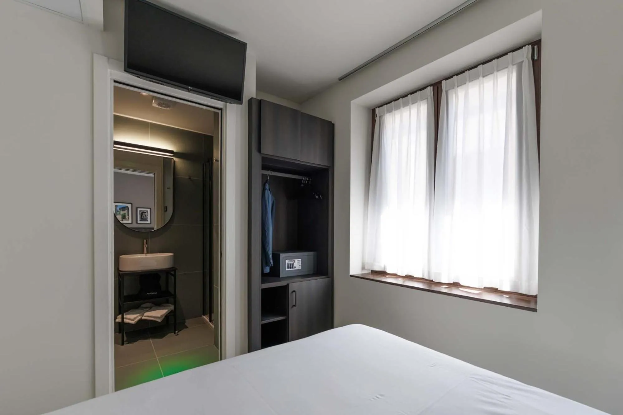 Bed in Hotel Stelvio Tirano