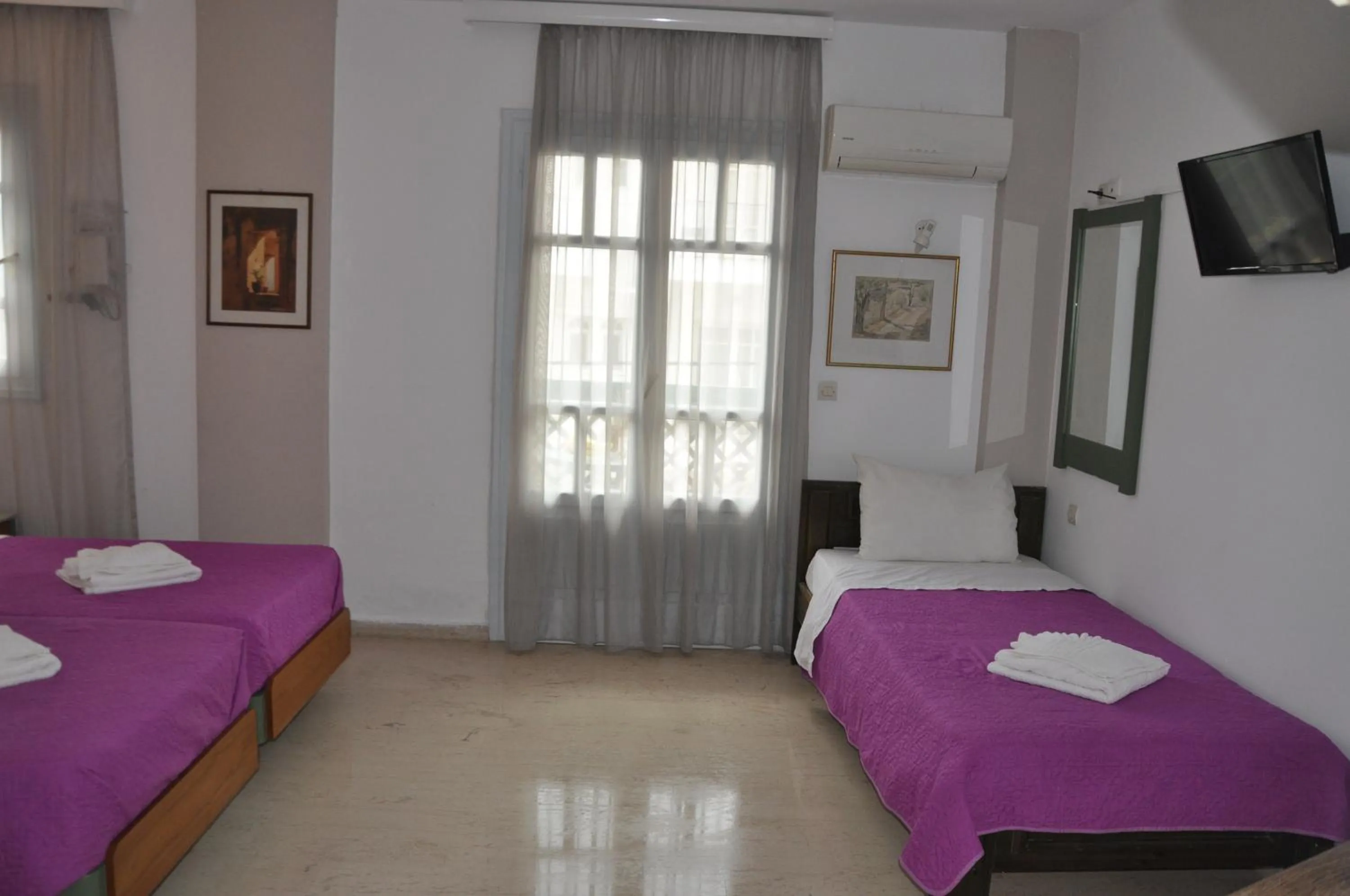 Bed in Helen Suites