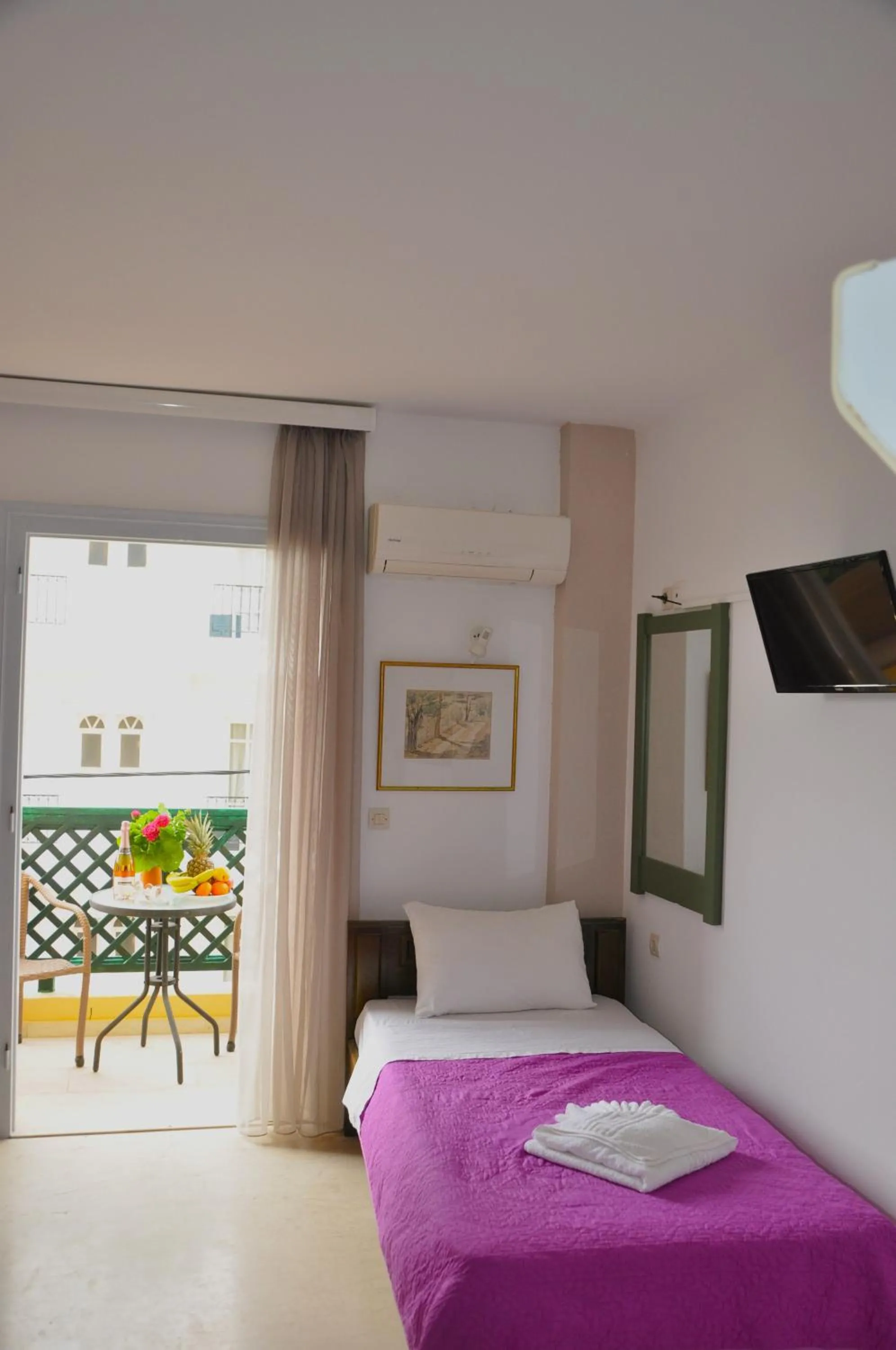 Bed in Helen Suites