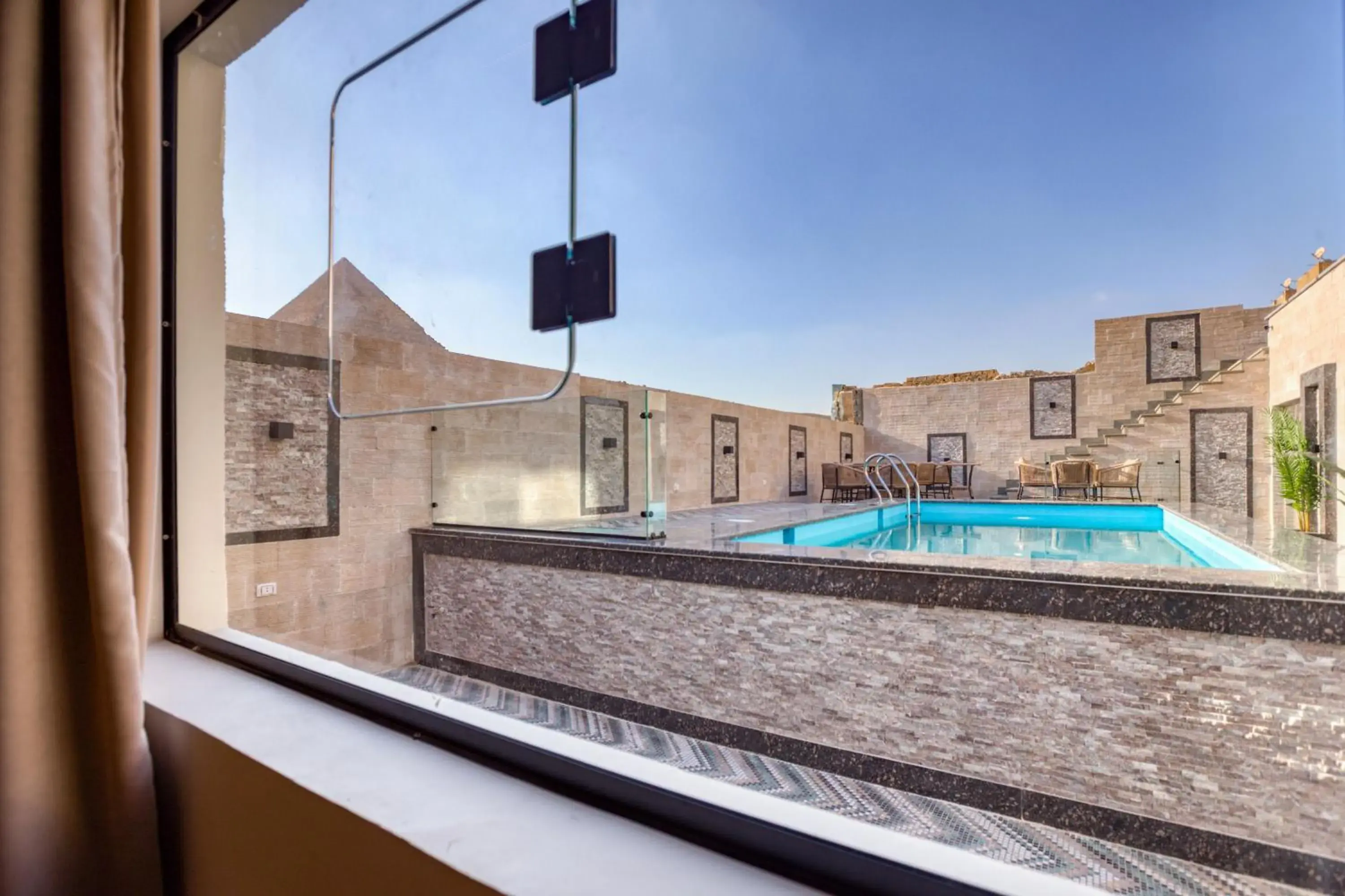 King Suite with Pyramids and Pool View in Beyond Pyramids View King Suite with Pyramids and Pool View in Beyond Pyramids View