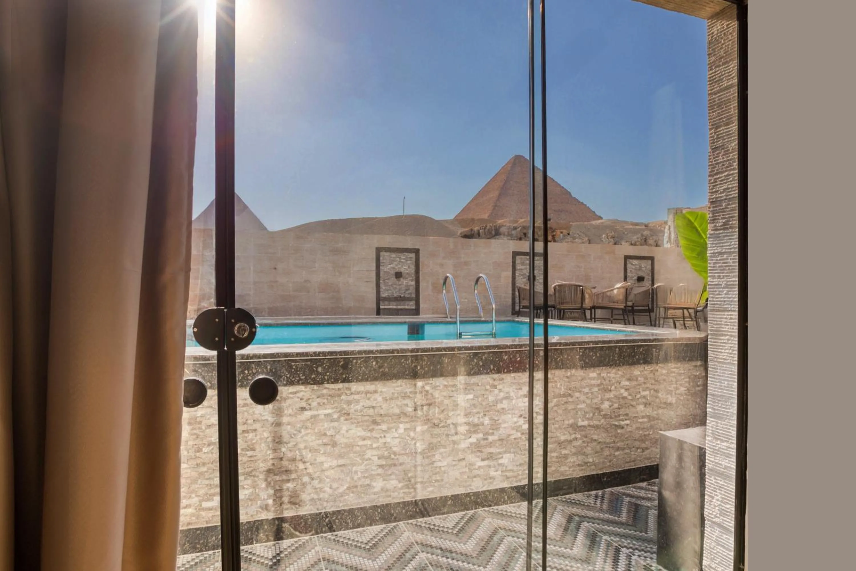 Deluxe Family Room with Pyramids and Pool View in Beyond Pyramids View