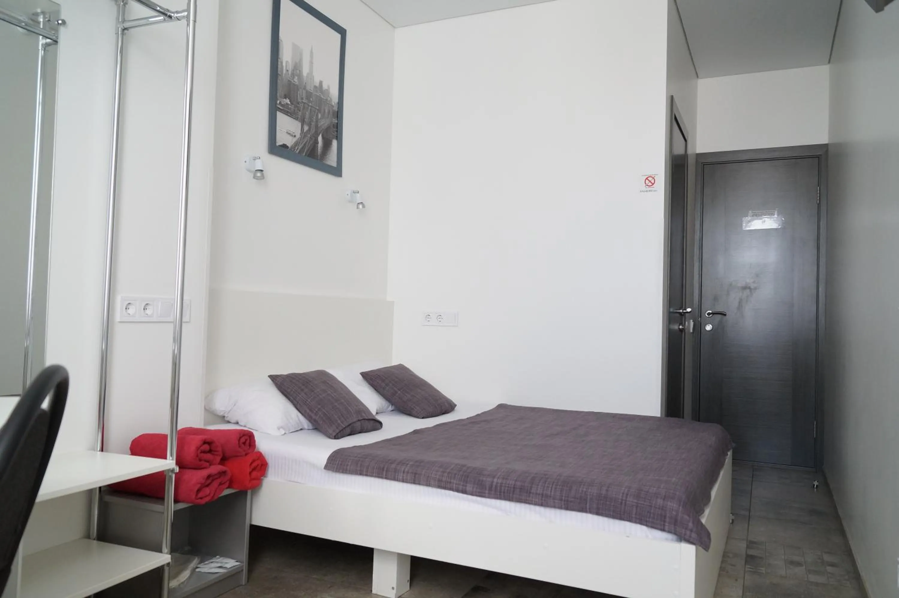 Bed in SkyHome Mini-hotel