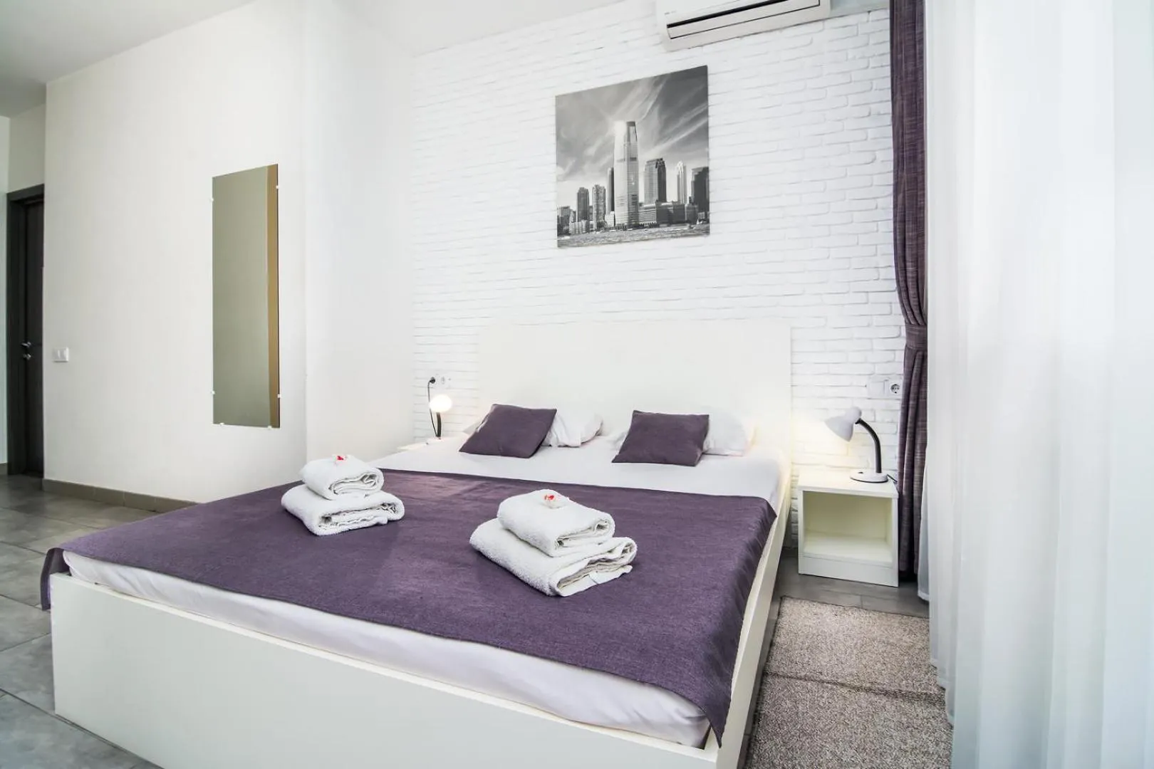 Bed in SkyHome Mini-hotel