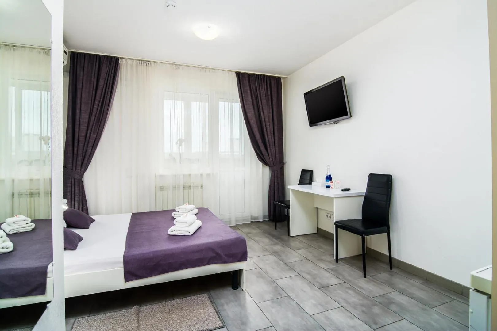 Bed in SkyHome Mini-hotel