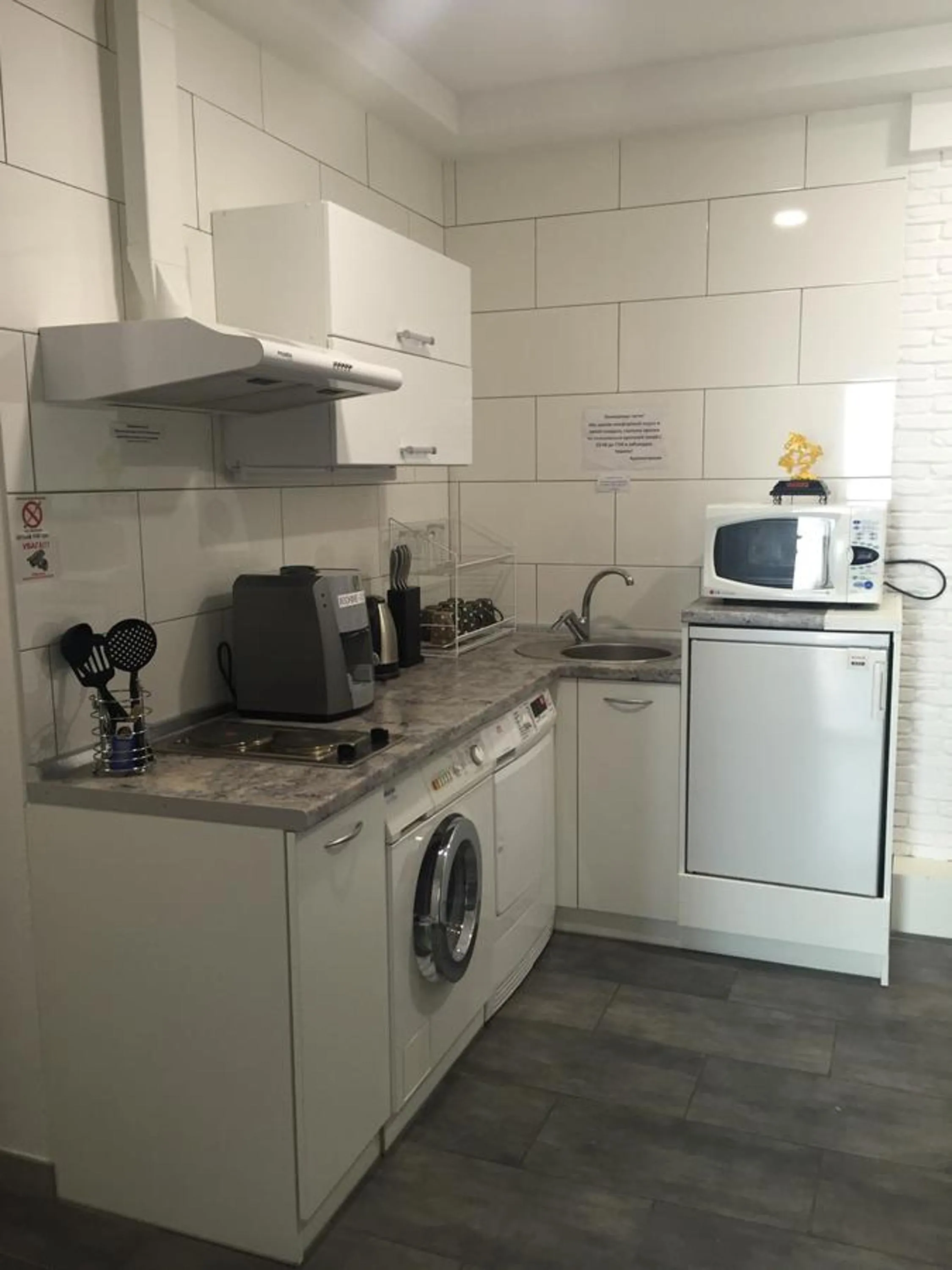 Kitchen or kitchenette in SkyHome Mini-hotel