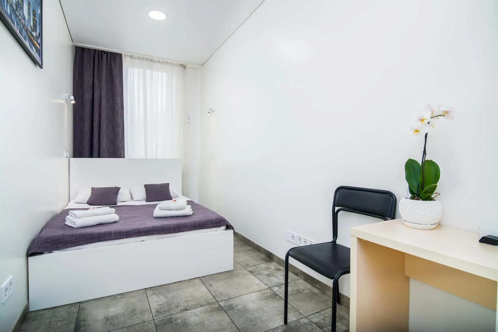 Bed in SkyHome Mini-hotel