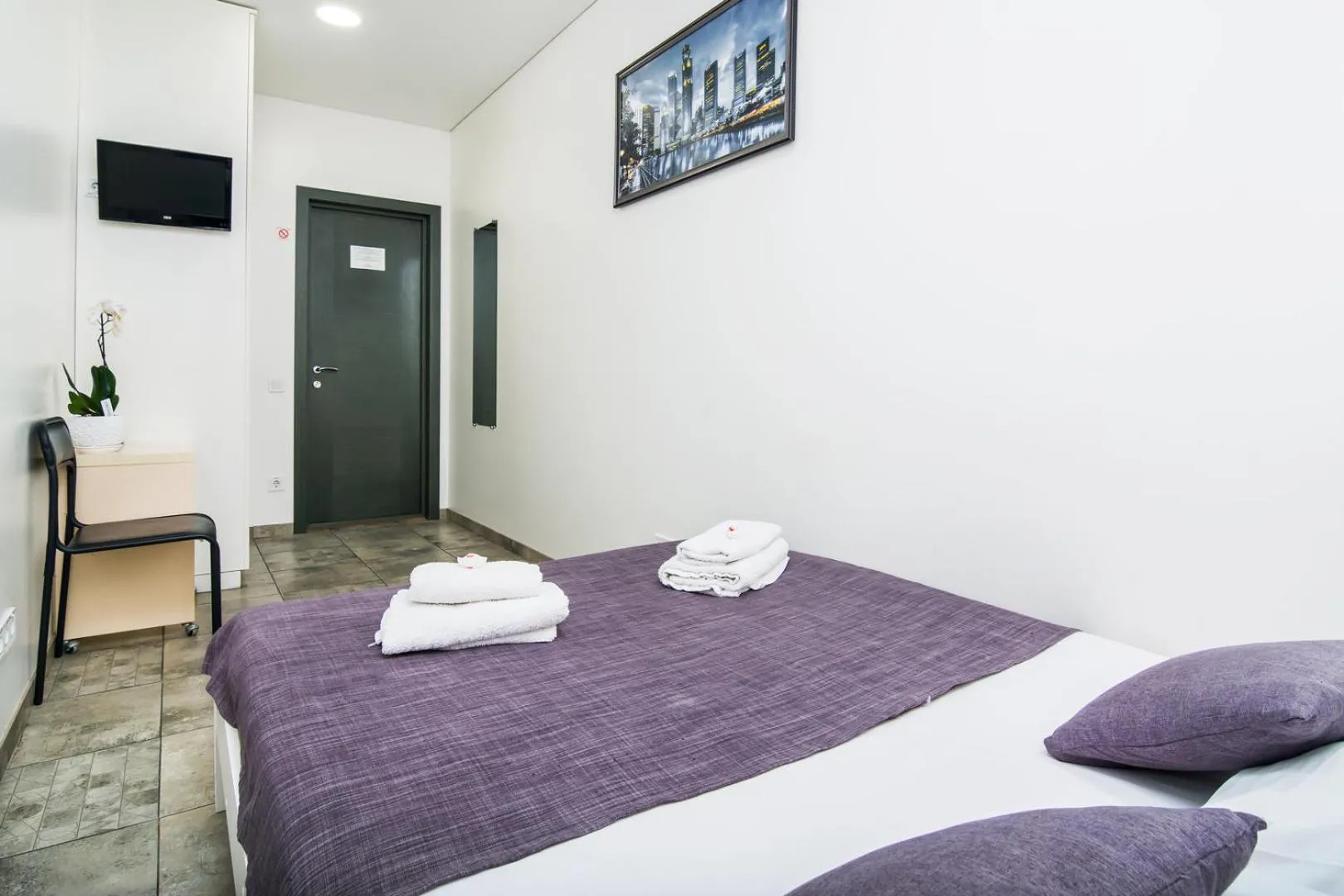 Bed in SkyHome Mini-hotel