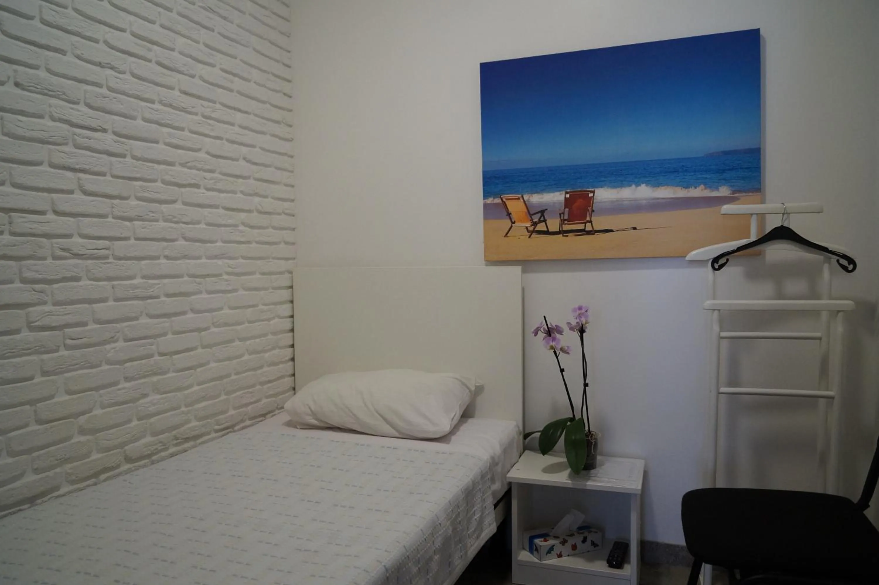Bed in SkyHome Mini-hotel