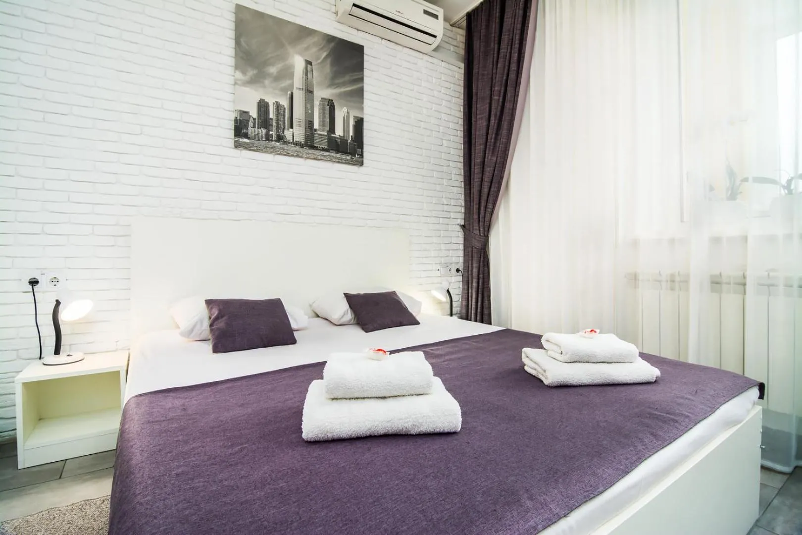 Bed in SkyHome Mini-hotel