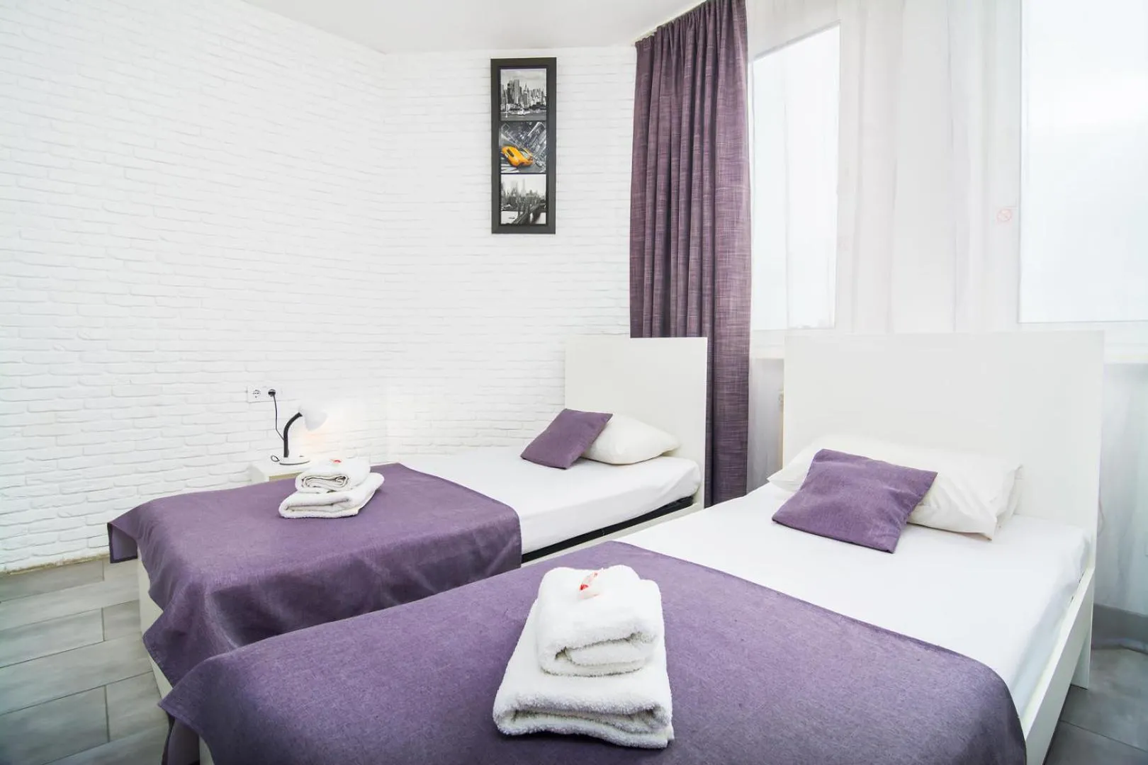 Bed in SkyHome Mini-hotel