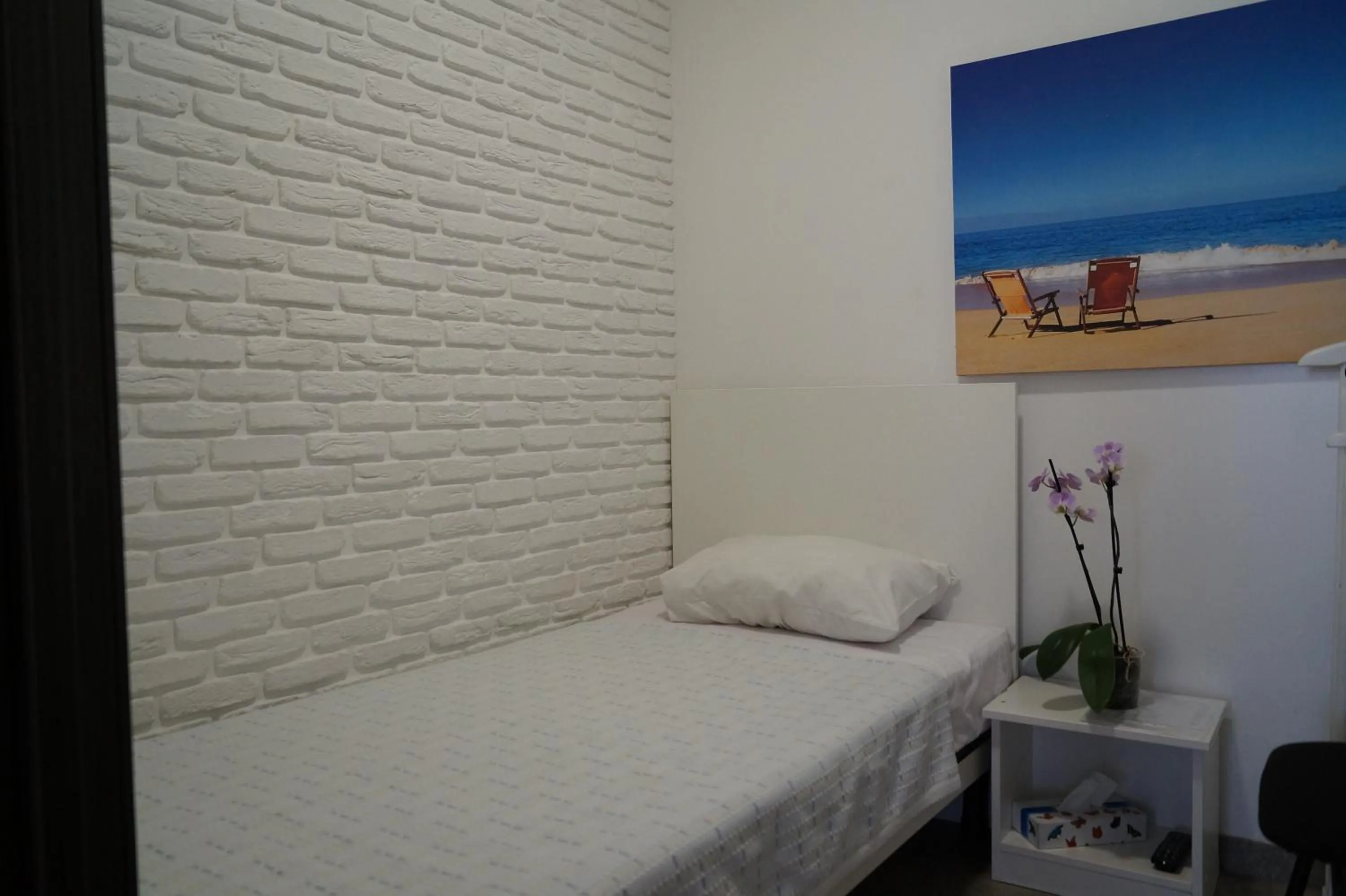 Bed in SkyHome Mini-hotel