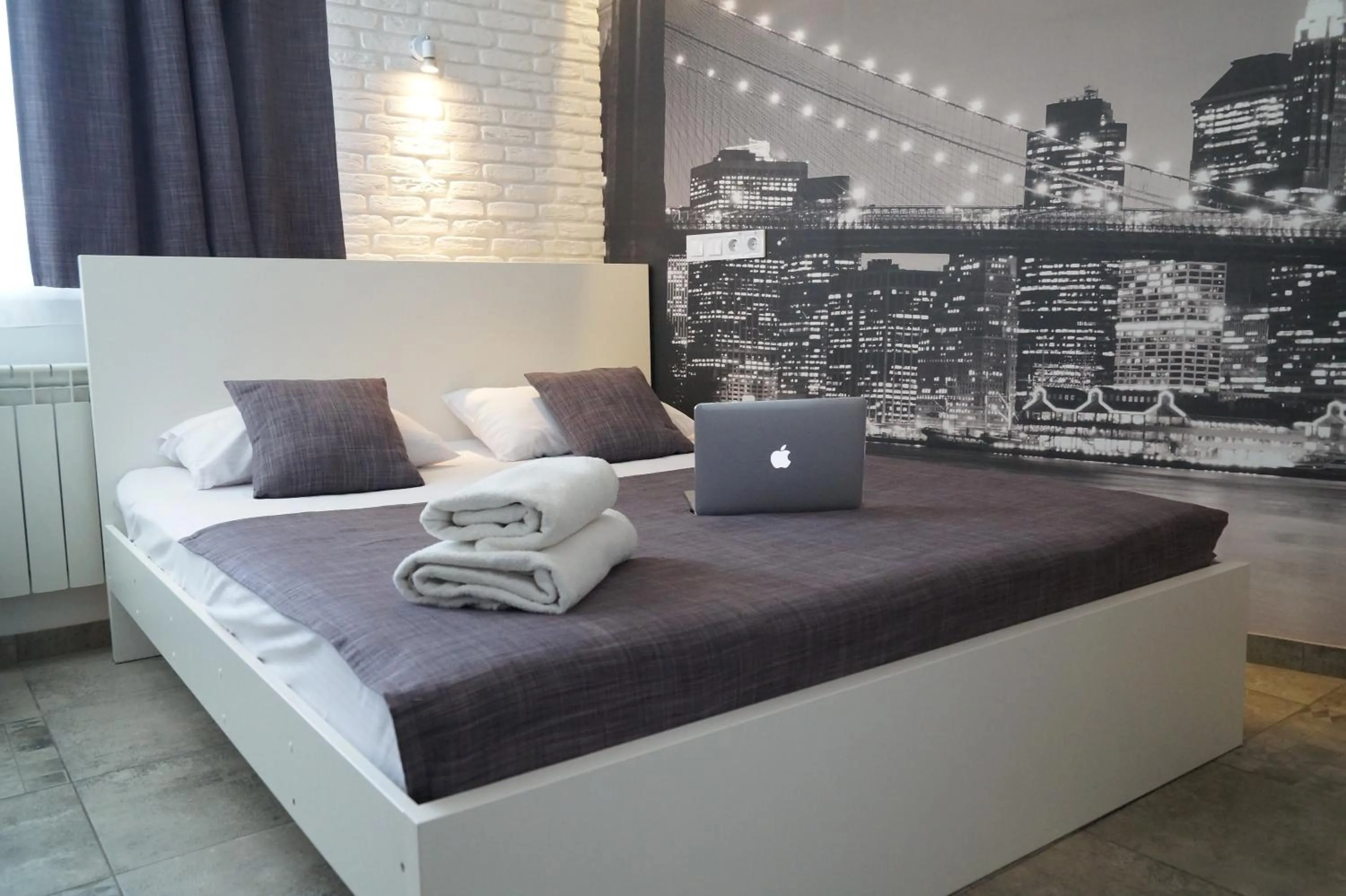 Bed in SkyHome Mini-hotel