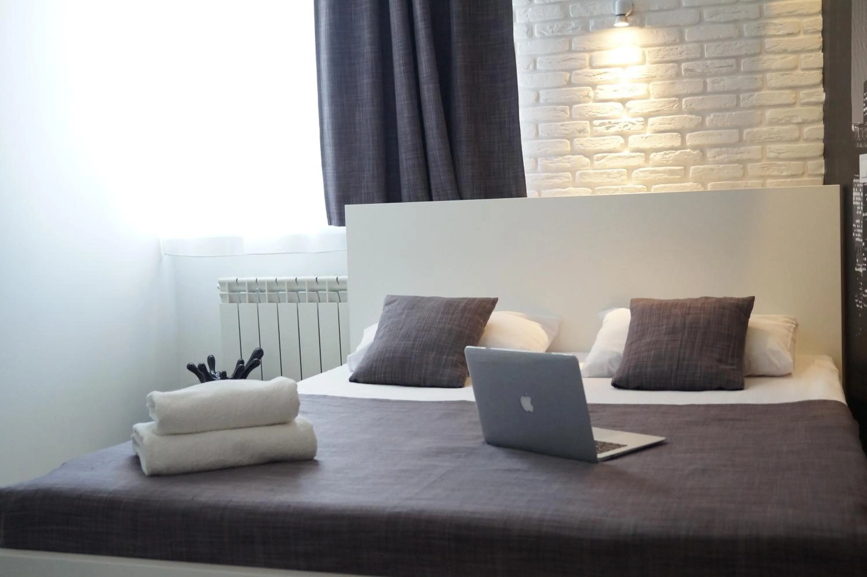 Bed in SkyHome Mini-hotel